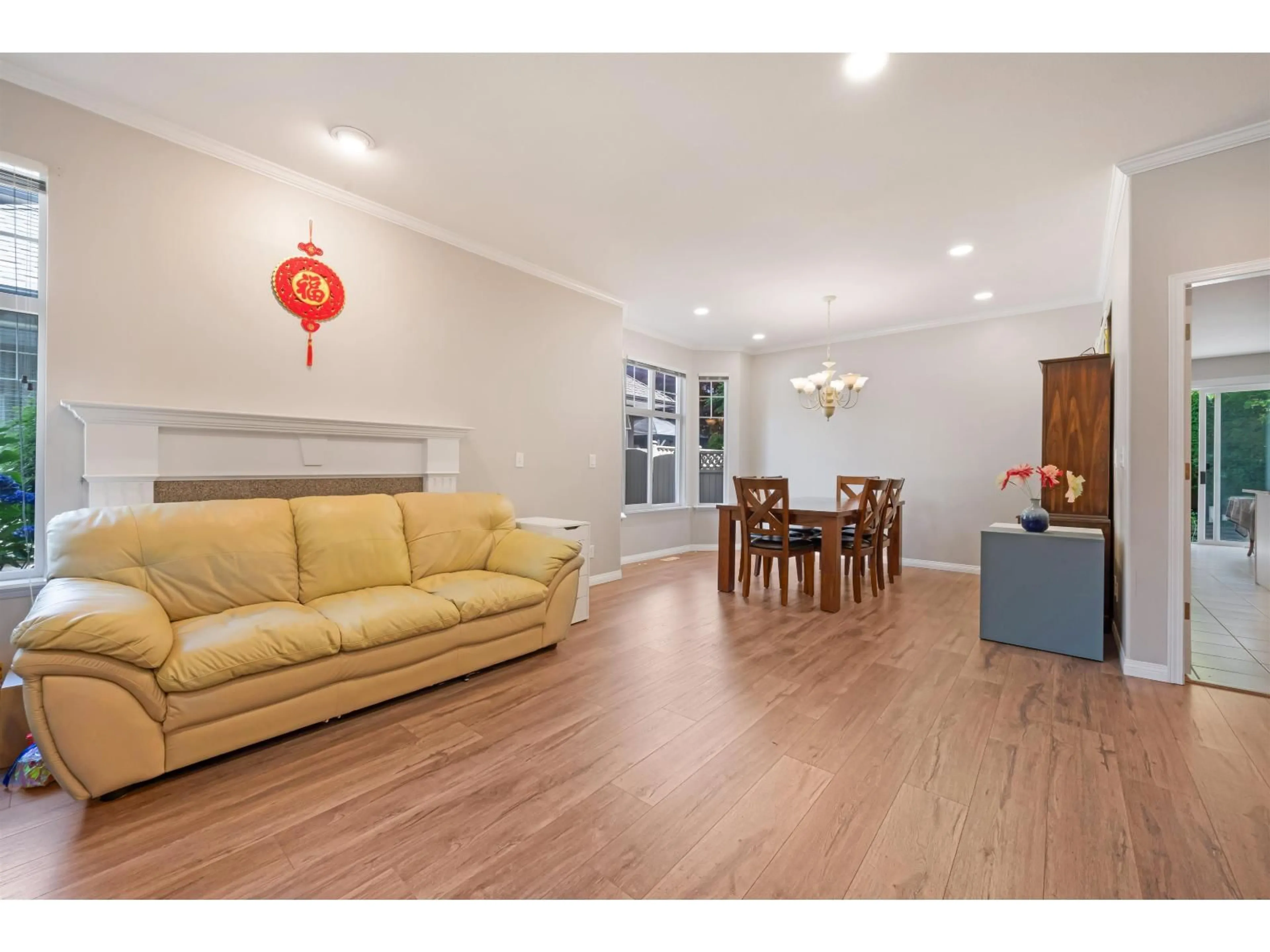 Living room with furniture, wood/laminate floor for 5816 122, Surrey British Columbia V3X3L5