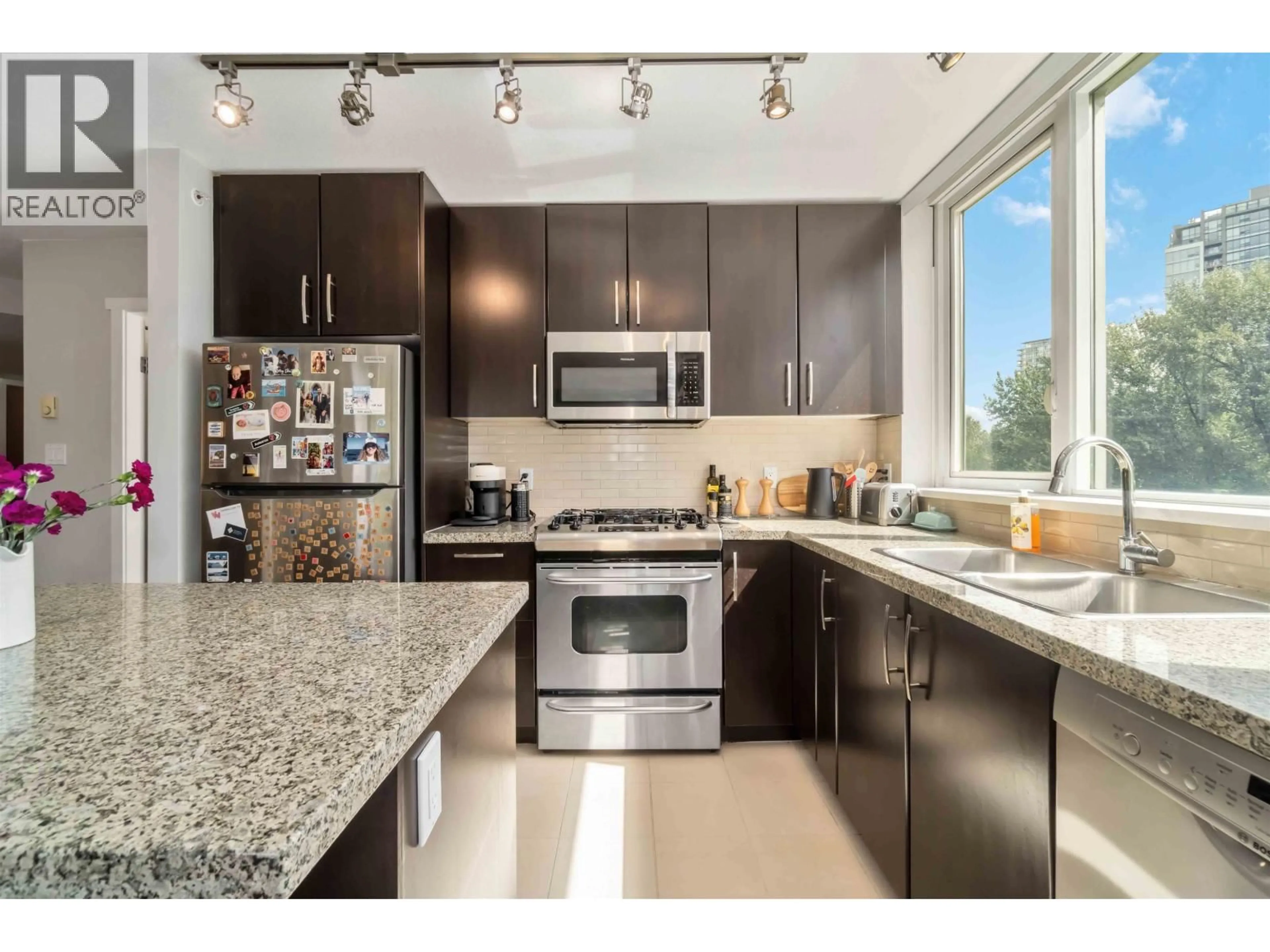 Open concept kitchen, ceramic/tile floor for 801 - 651 NOOTKA WAY, Port Moody British Columbia V3H0A1