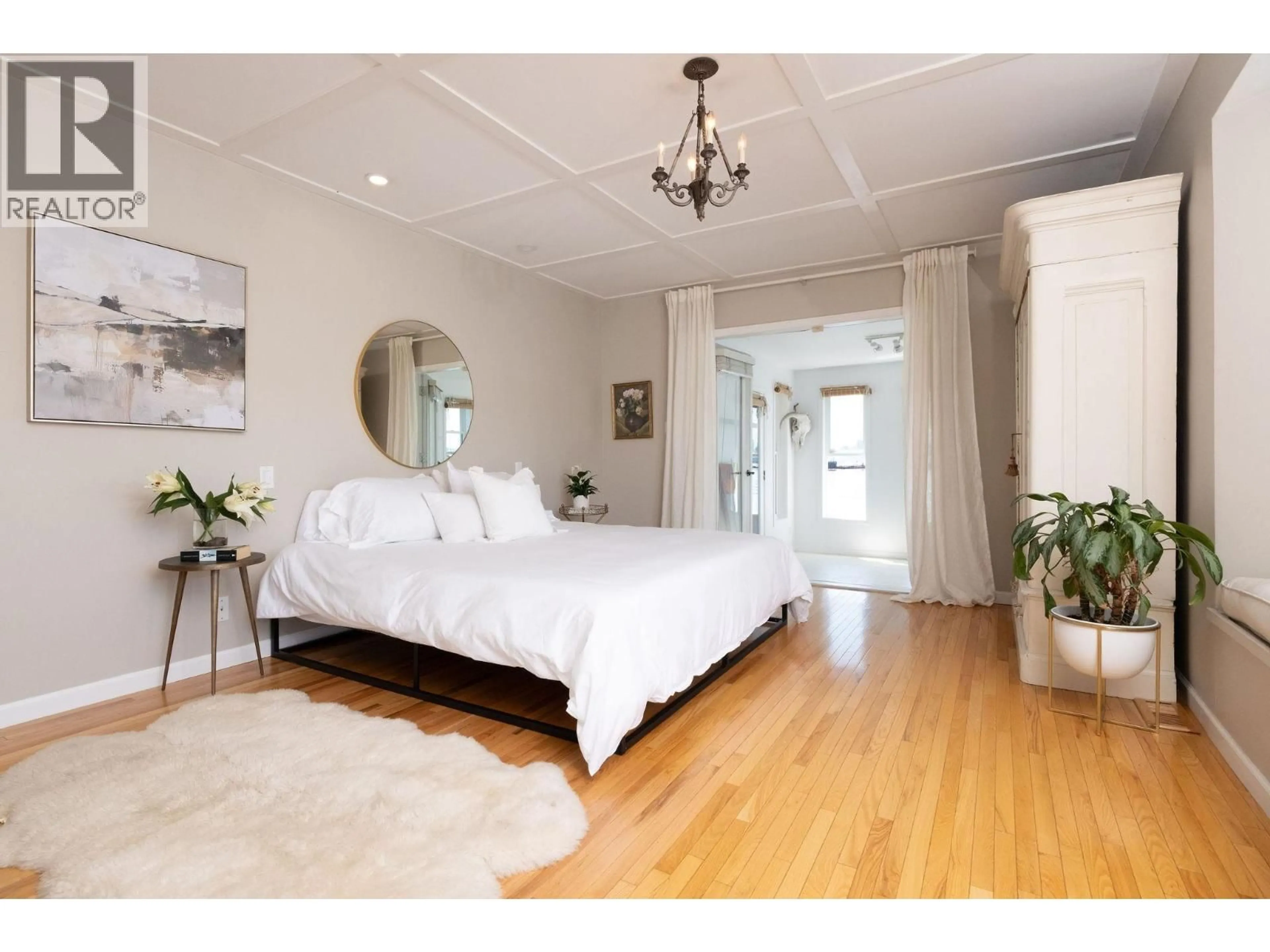 Bedroom with bed, wood/laminate floor for A27 - 415 ESPLANADE AVENUE, North Vancouver British Columbia V7M1A6