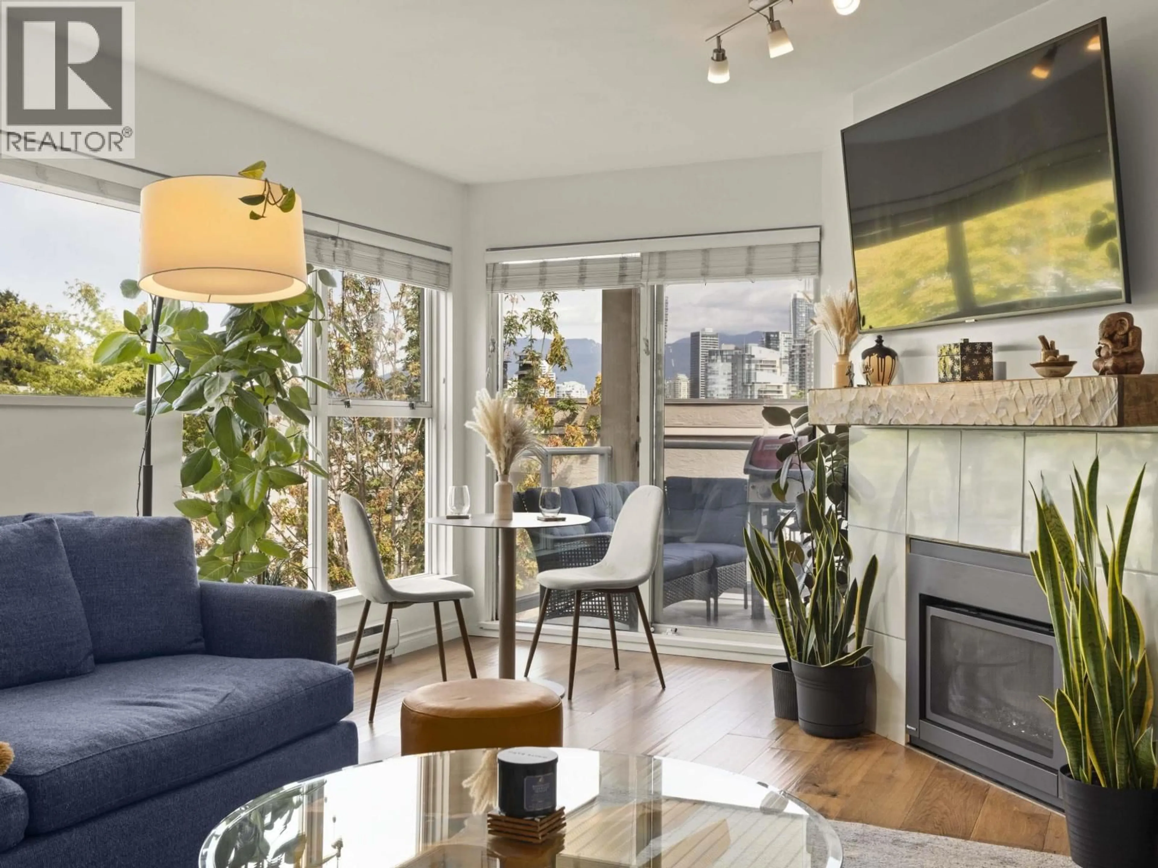 Living room with furniture, wood/laminate floor for 105 - 933 8TH AVENUE, Vancouver British Columbia V5Z1E4