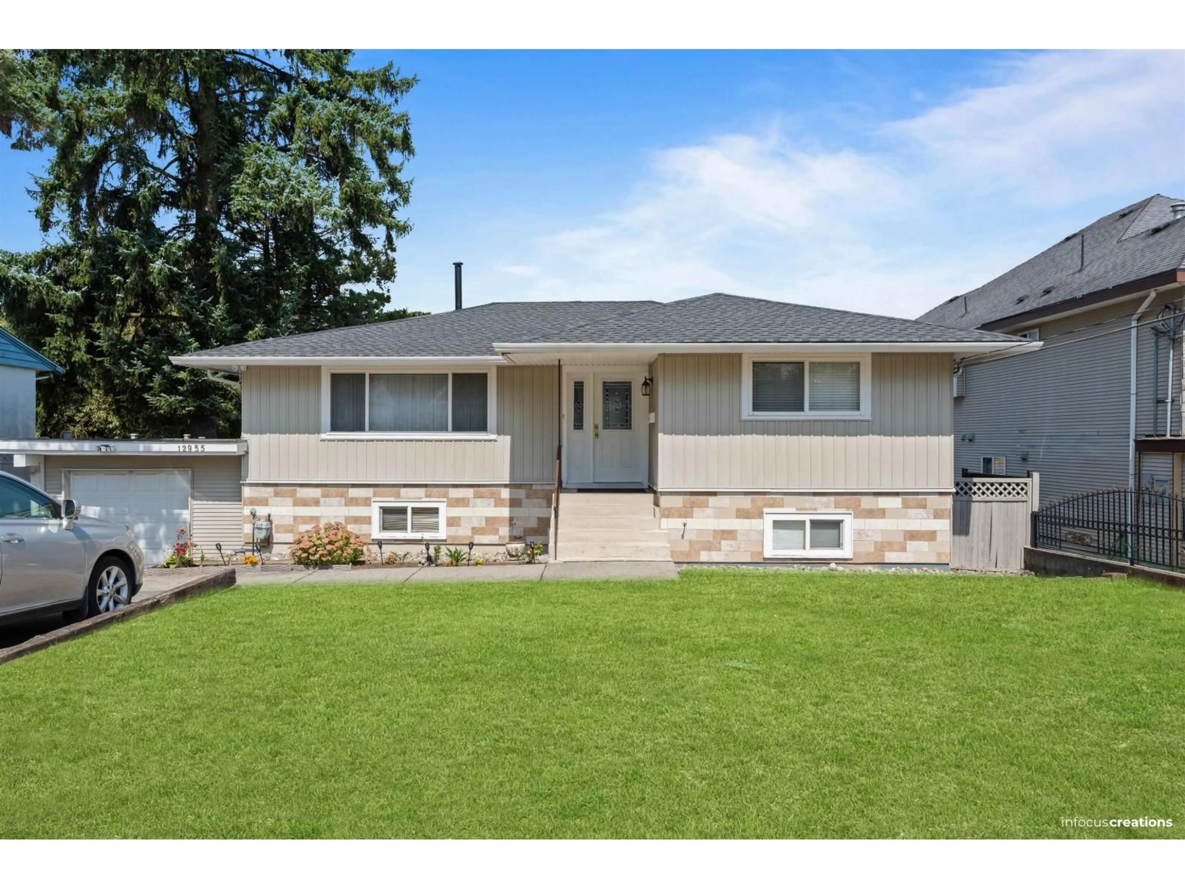 Home with vinyl exterior material, street for 12955 106A, Surrey British Columbia V3T2E3