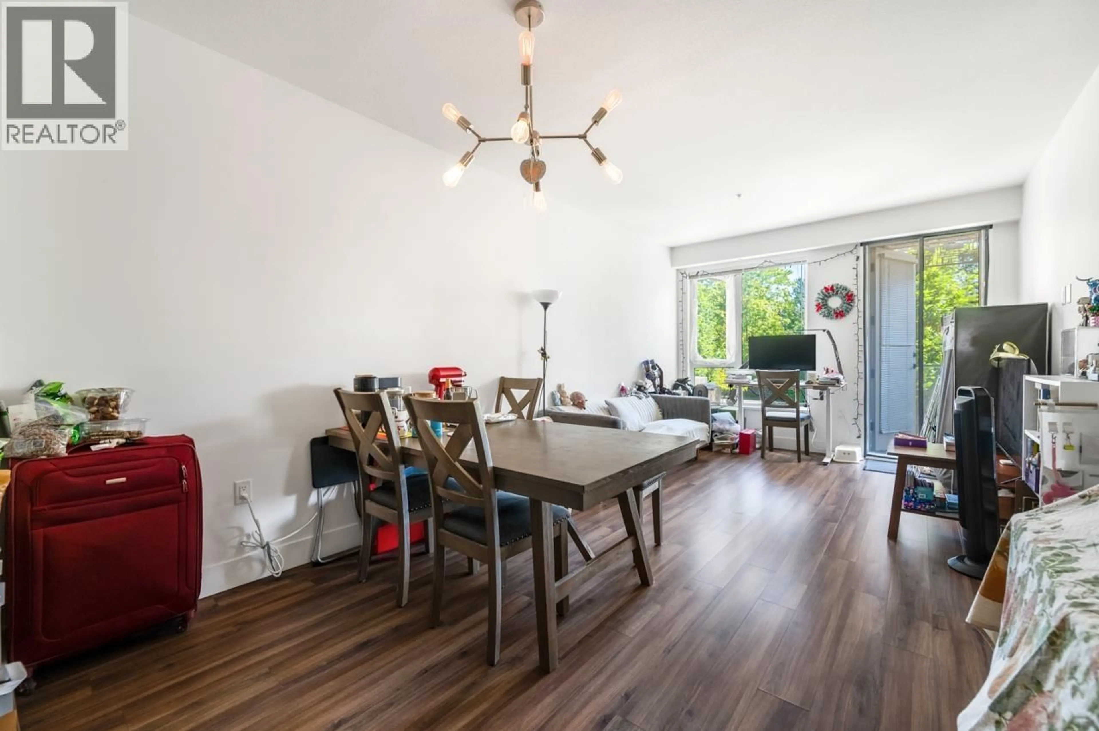 Dining room, wood/laminate floor for 205 - 6933 CAMBIE STREET, Vancouver British Columbia V6P0J1