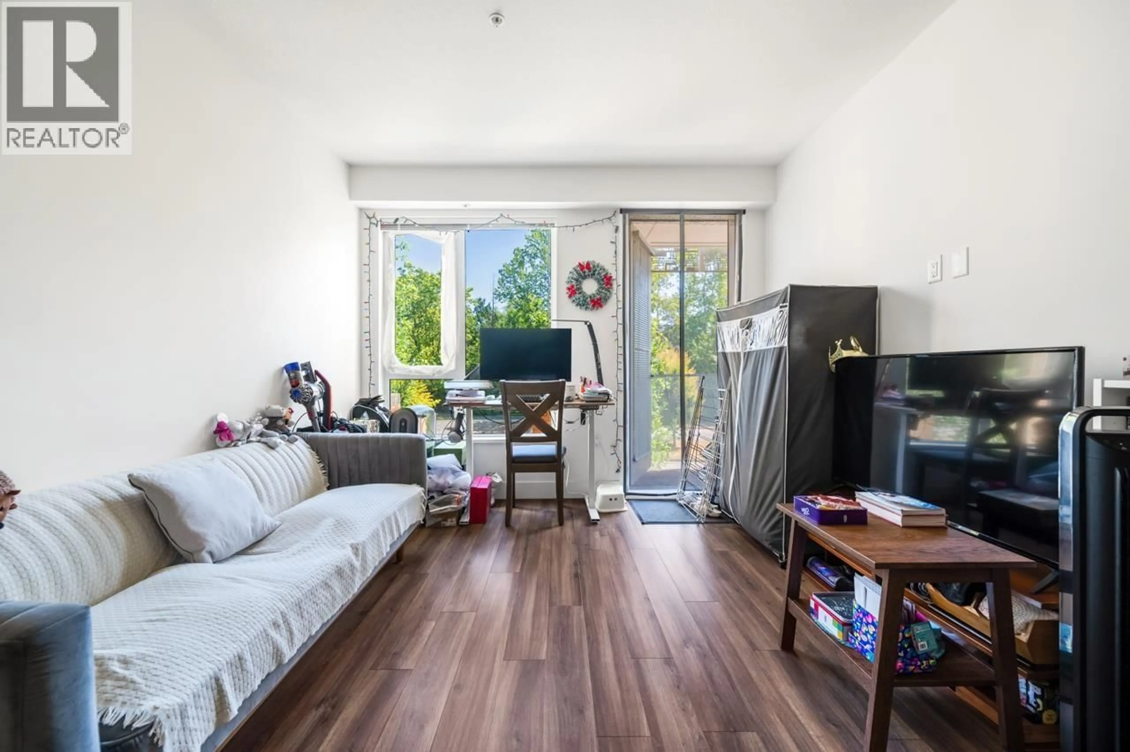 Living room with furniture, unknown for 205 - 6933 CAMBIE STREET, Vancouver British Columbia V6P0J1