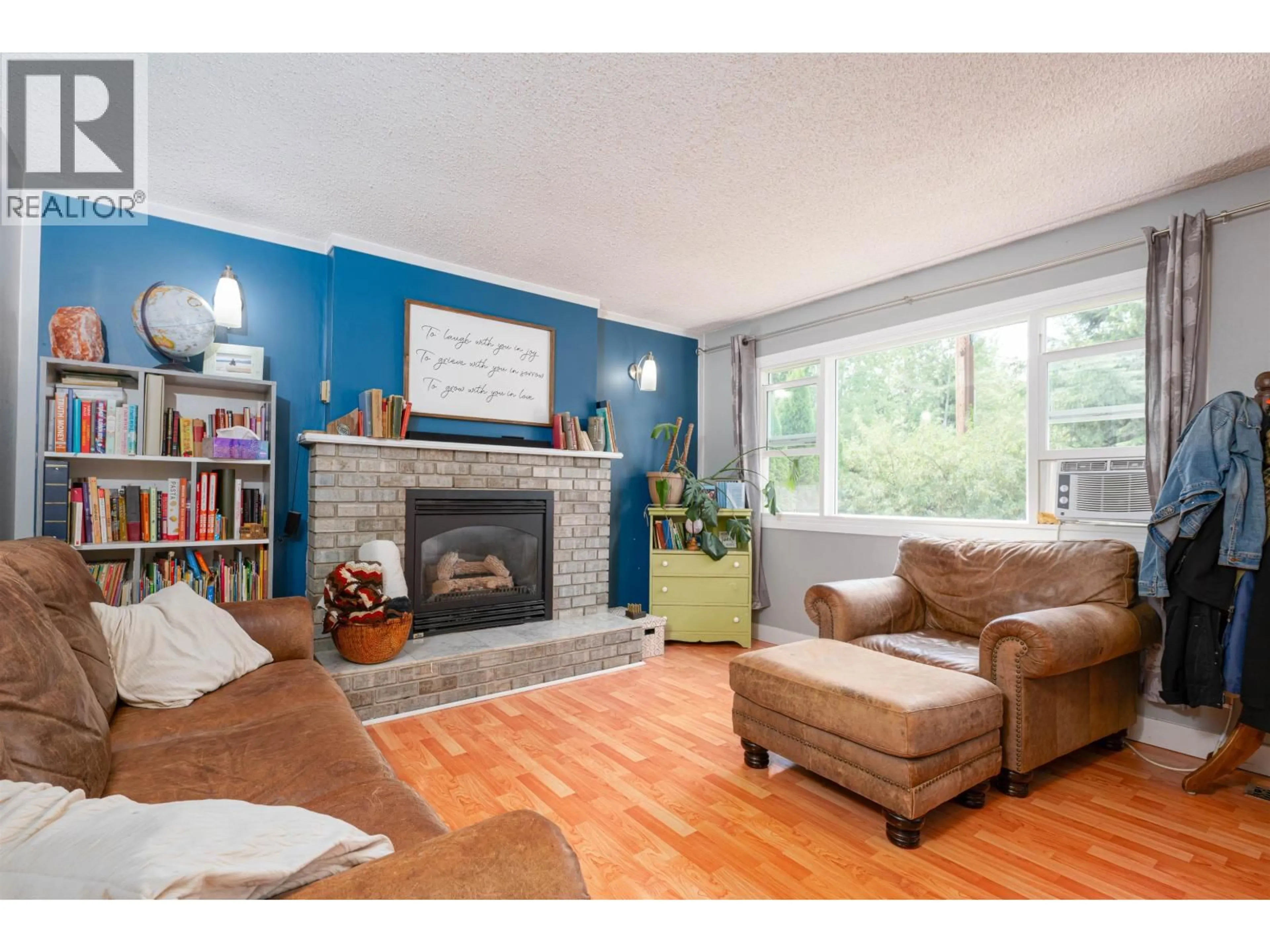 Living room with furniture, wood/laminate floor for 1900 BITTNER ROAD, Prince George British Columbia V2N6T1