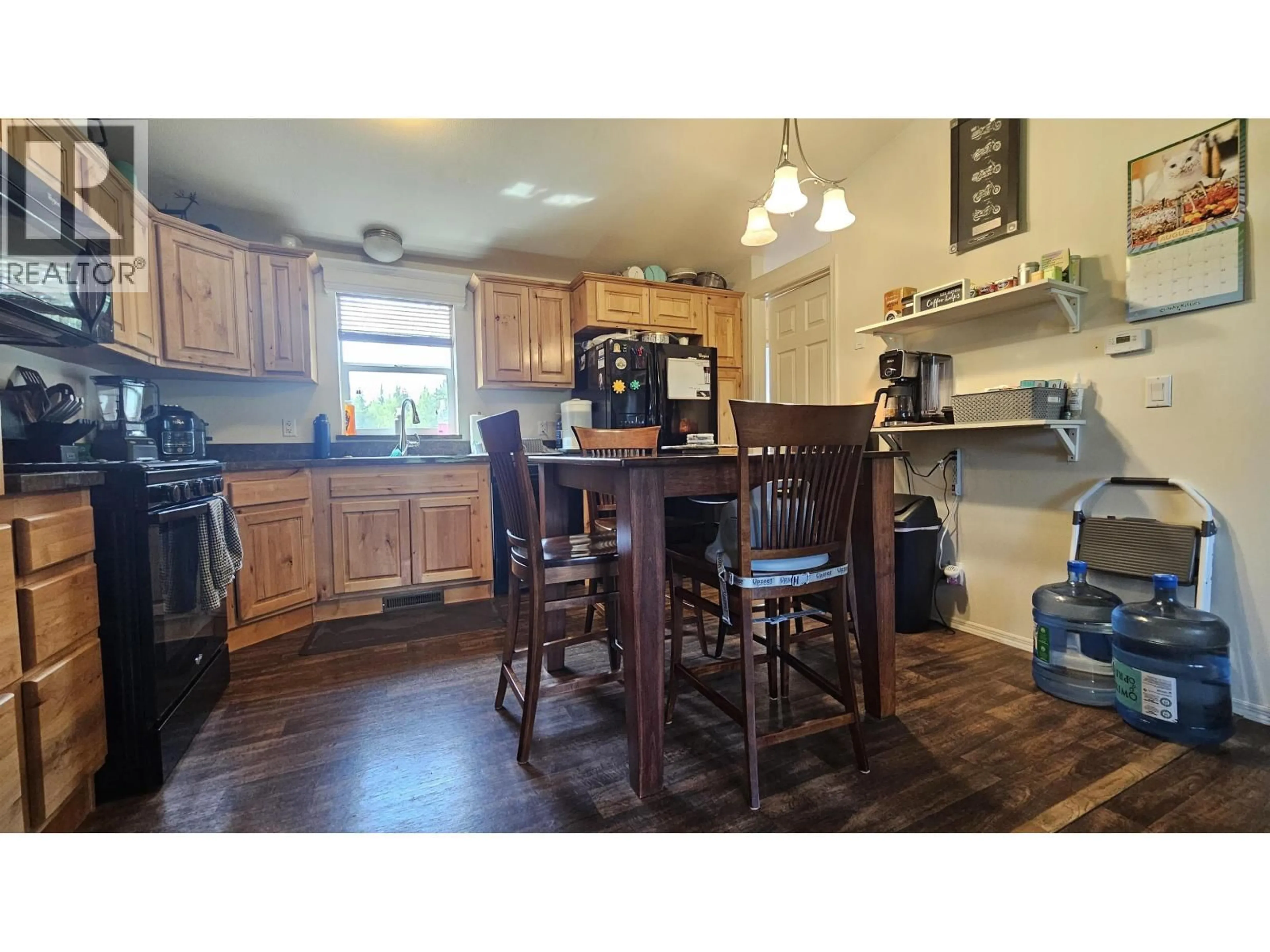 Open concept kitchen, wood/laminate floor for 5525 COURVAL ROAD, Prince George British Columbia V2N6A4