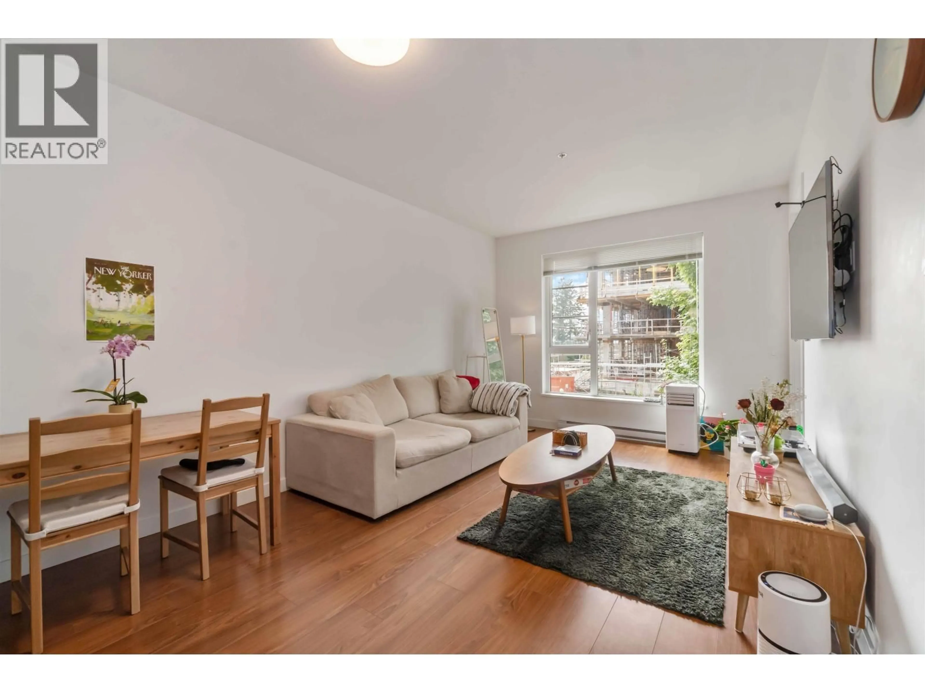 Living room with furniture, wood/laminate floor for 106 - 516 FOSTER AVENUE, Coquitlam British Columbia V3J0H8