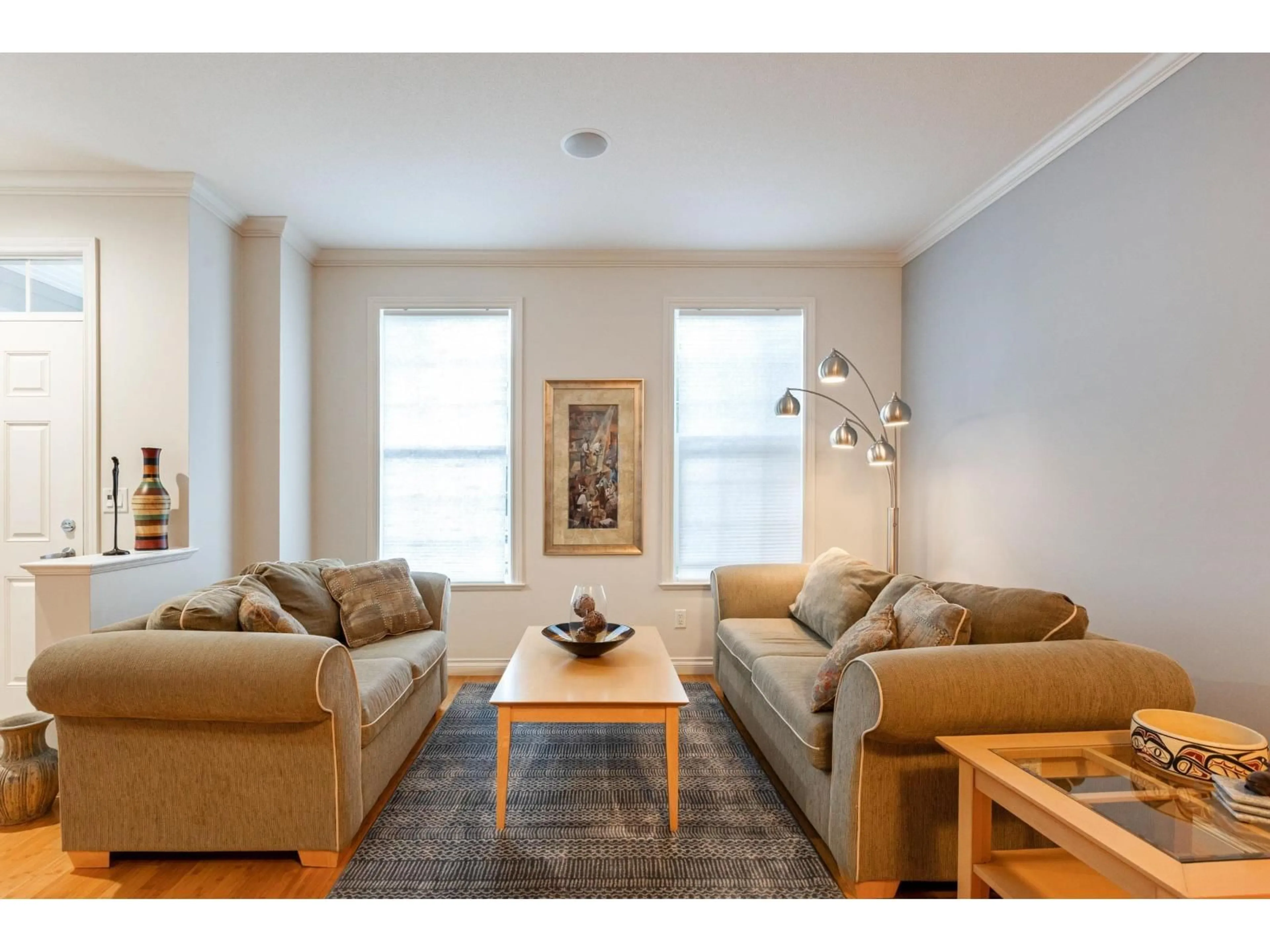 Living room with furniture, wood/laminate floor for 7014 179A, Surrey British Columbia V3S7S4