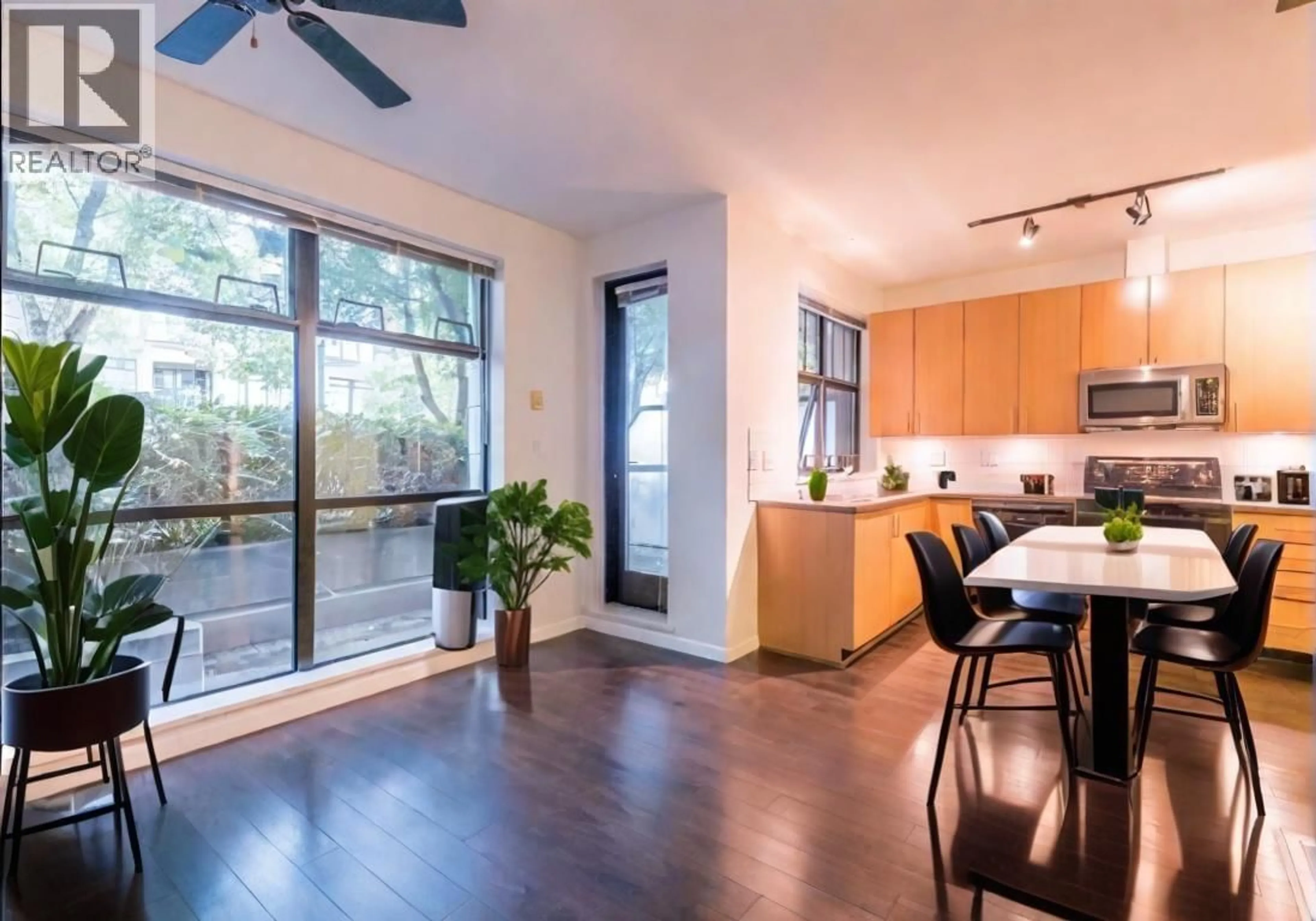 Open concept kitchen, wood/laminate floor for 101 - 2065 12TH AVENUE, Vancouver British Columbia V6J5L9