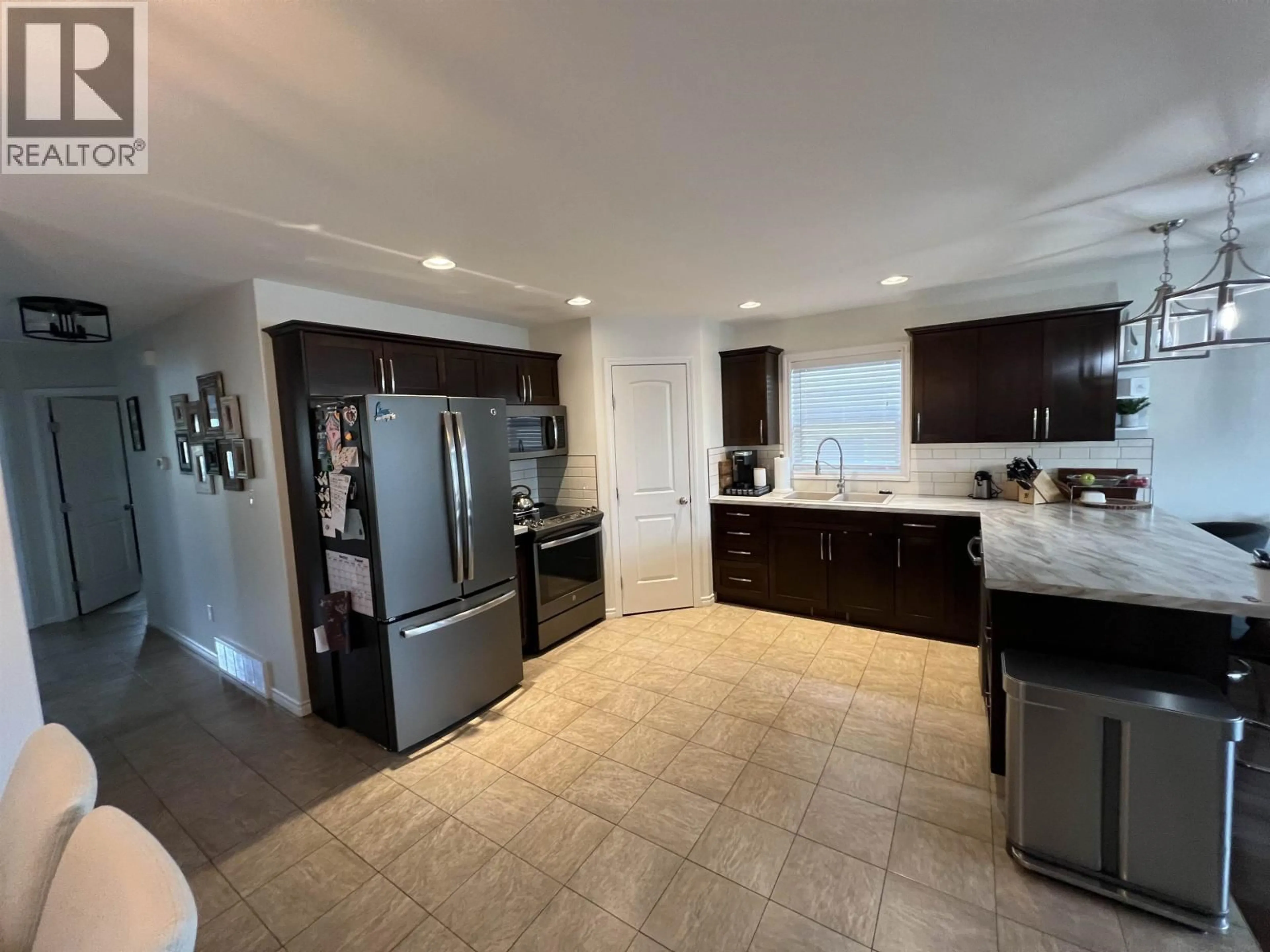 Open concept kitchen, ceramic/tile floor for 8832 113 AVENUE, Fort St. John British Columbia V1J0E2