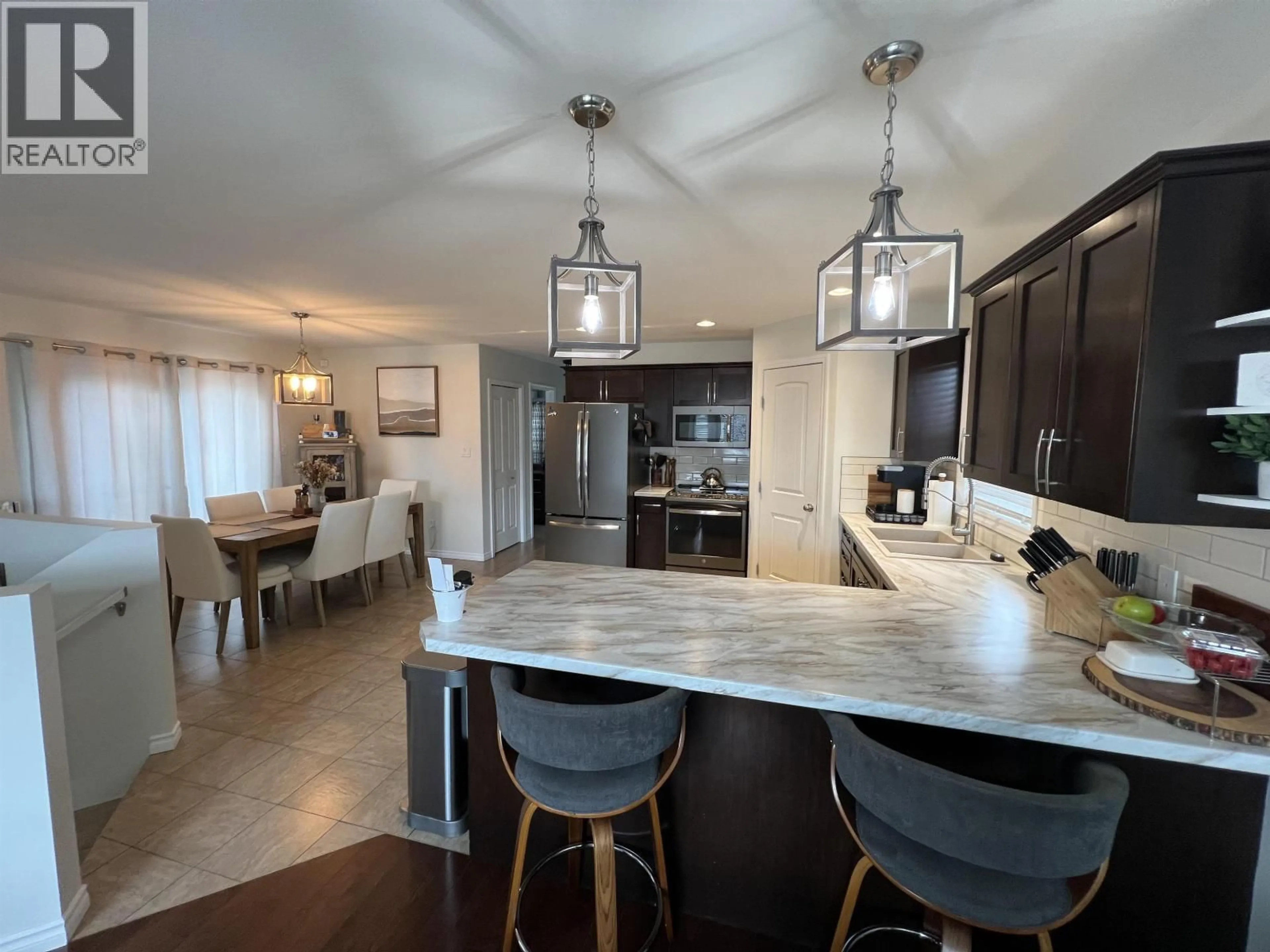 Open concept kitchen, ceramic/tile floor for 8832 113 AVENUE, Fort St. John British Columbia V1J0E2