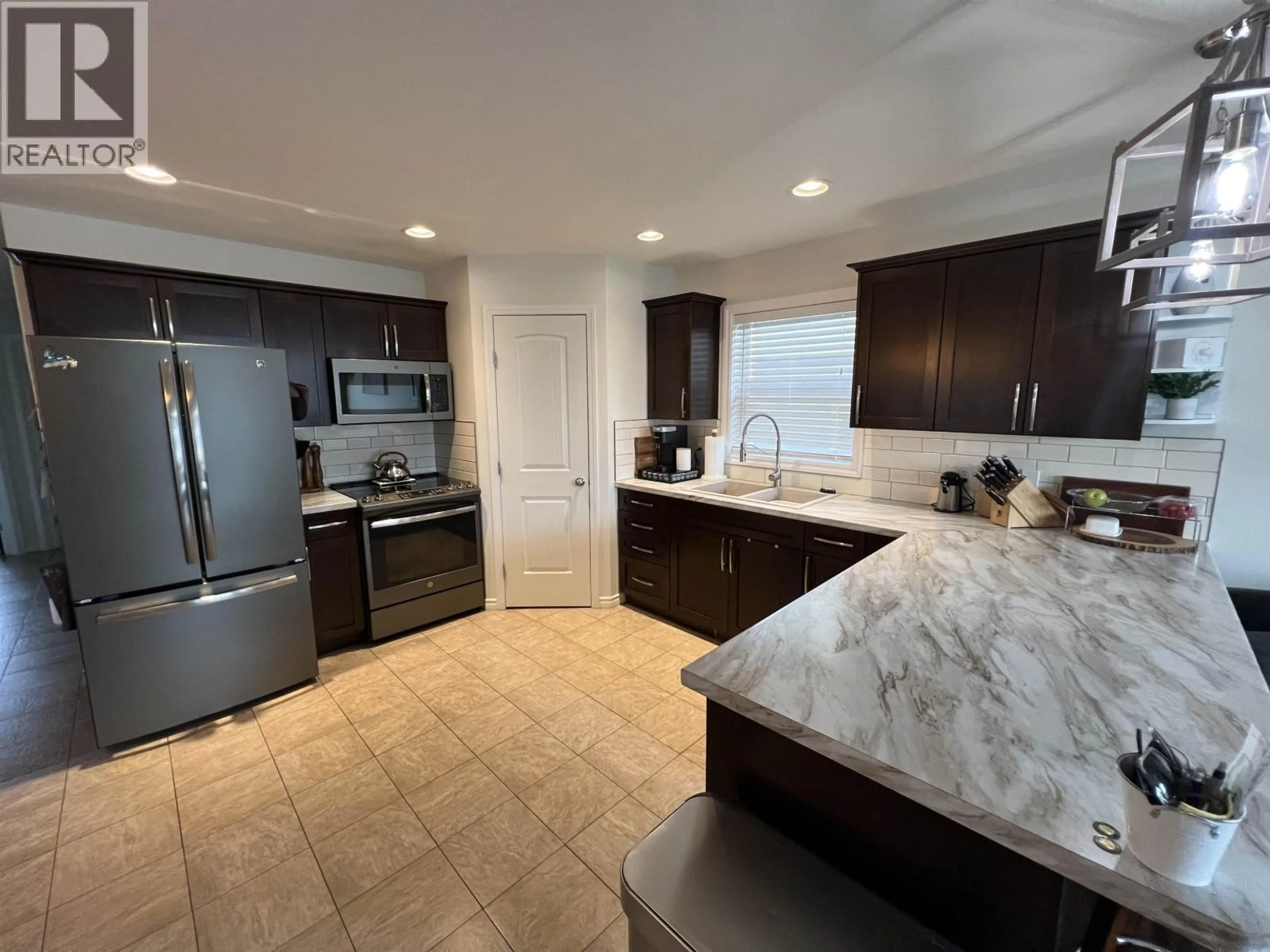 Open concept kitchen, ceramic/tile floor for 8832 113 AVENUE, Fort St. John British Columbia V1J0E2