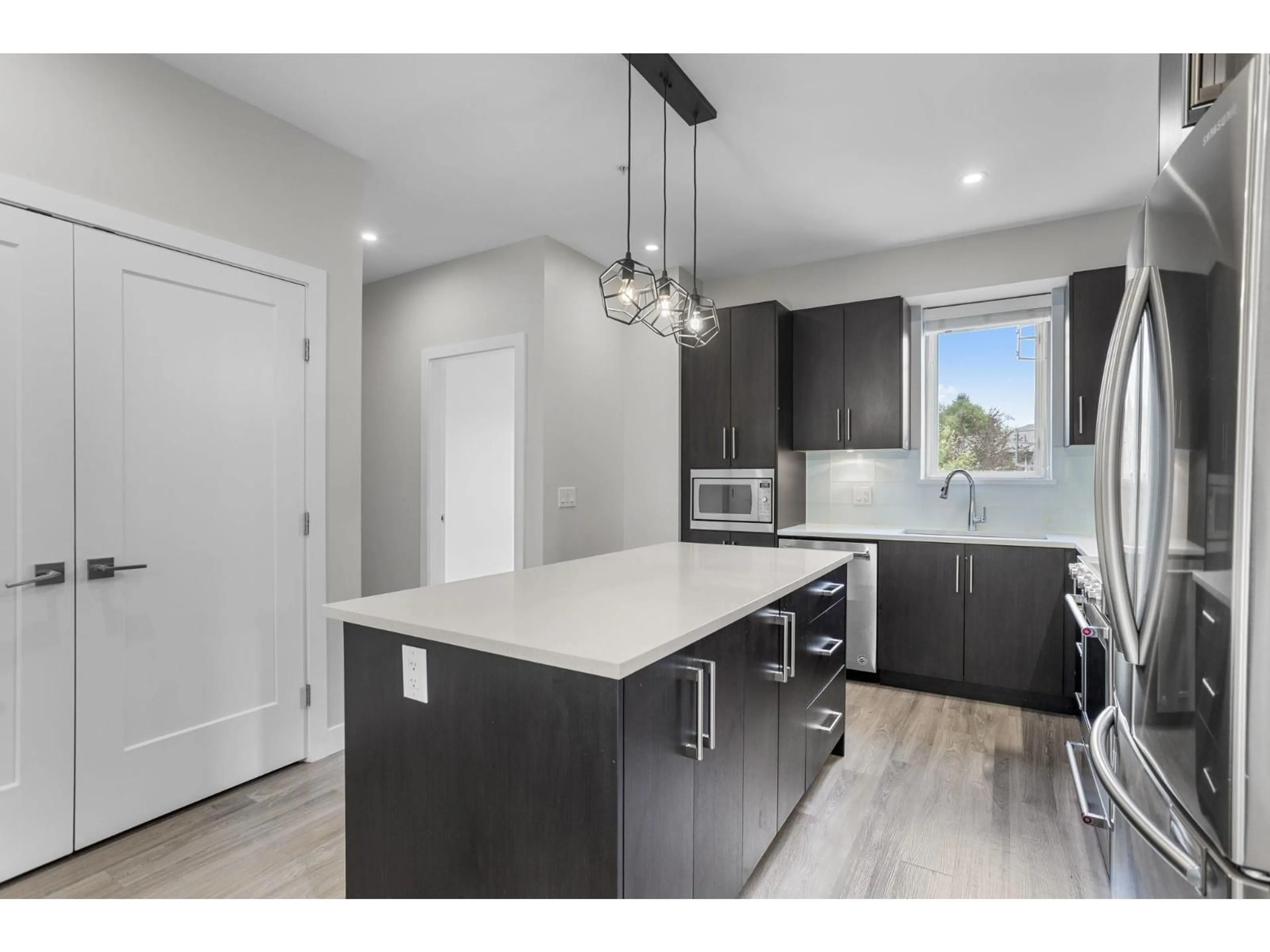 Open concept kitchen, unknown for 306 - 15436 31, Surrey British Columbia V3Z1H3