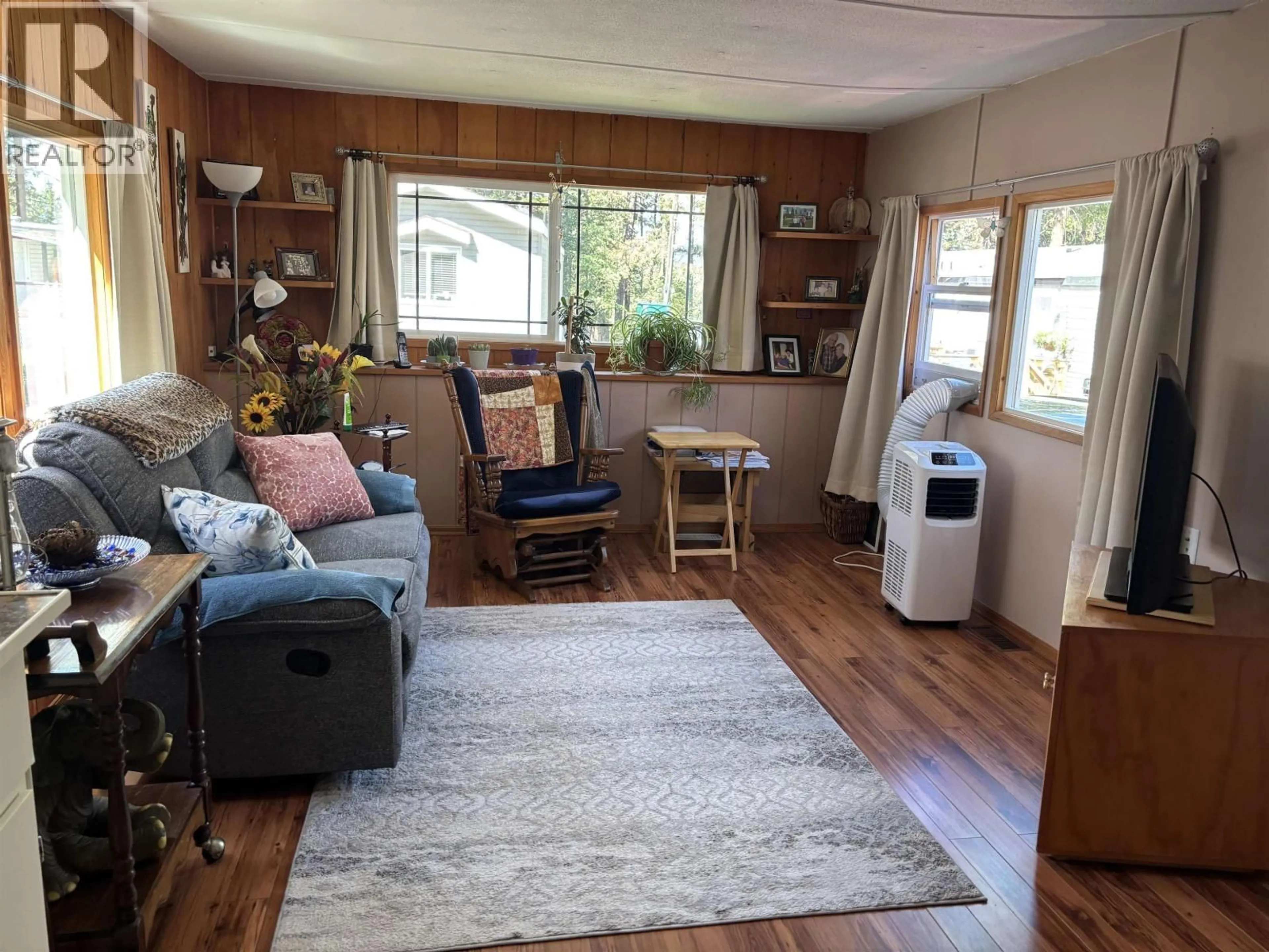 Living room with furniture, wood/laminate floor for 19 - 1322 DOG CREEK ROAD, Williams Lake British Columbia V2G3G9