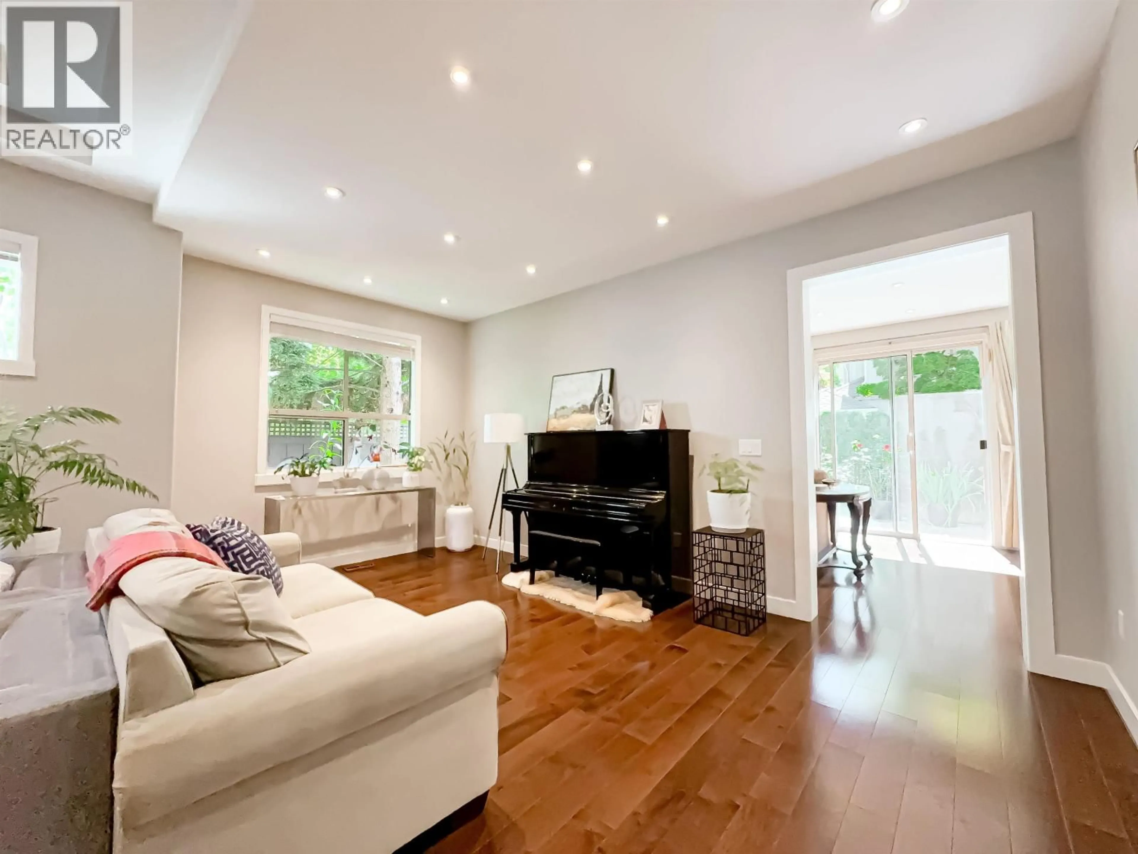Living room with furniture, wood/laminate floor for 104 - 3555 WESTMINSTER HIGHWAY, Richmond British Columbia V7C5P6