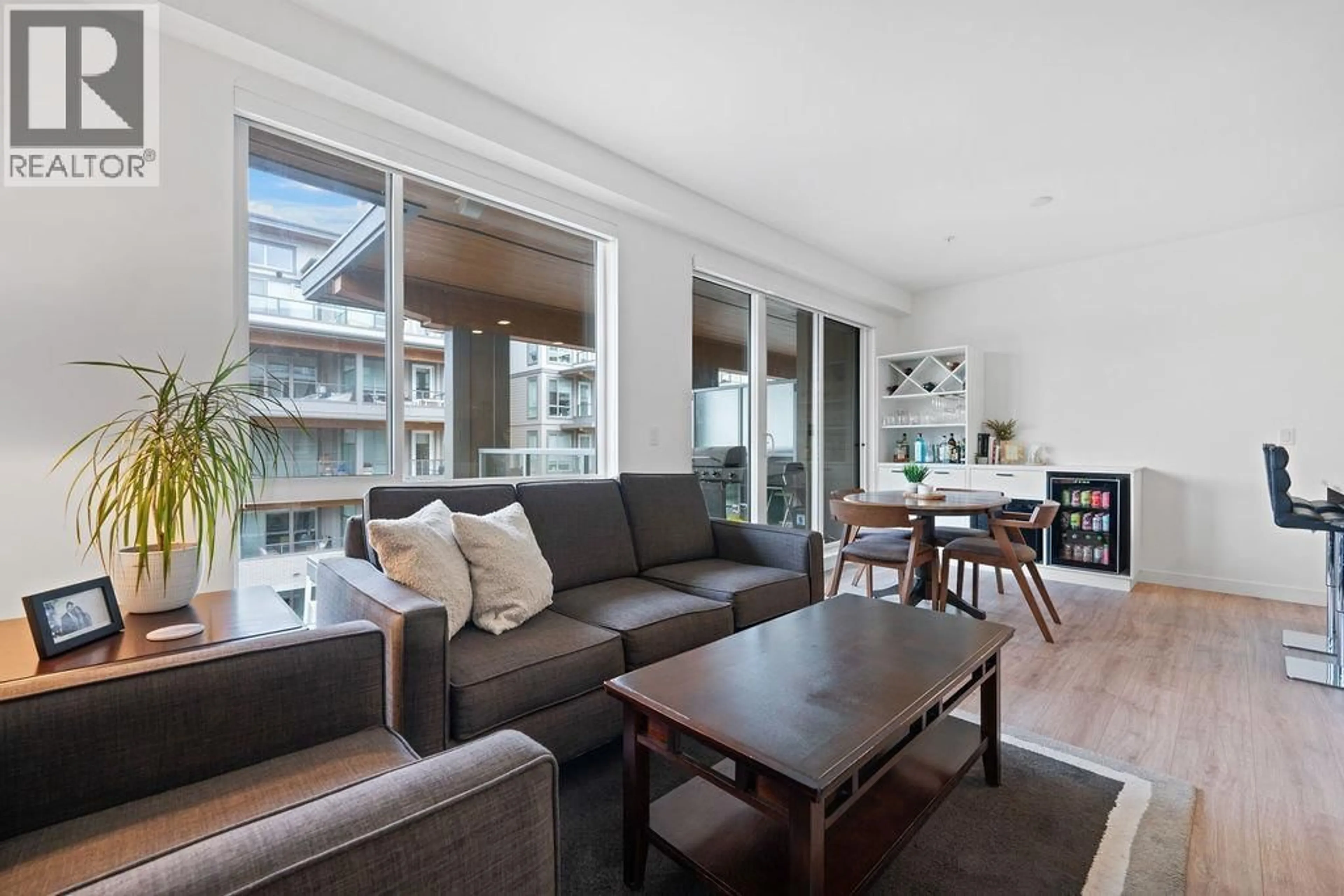 Living room with furniture, wood/laminate floor for 404 - 7133 14TH AVENUE, Burnaby British Columbia V3N0H5