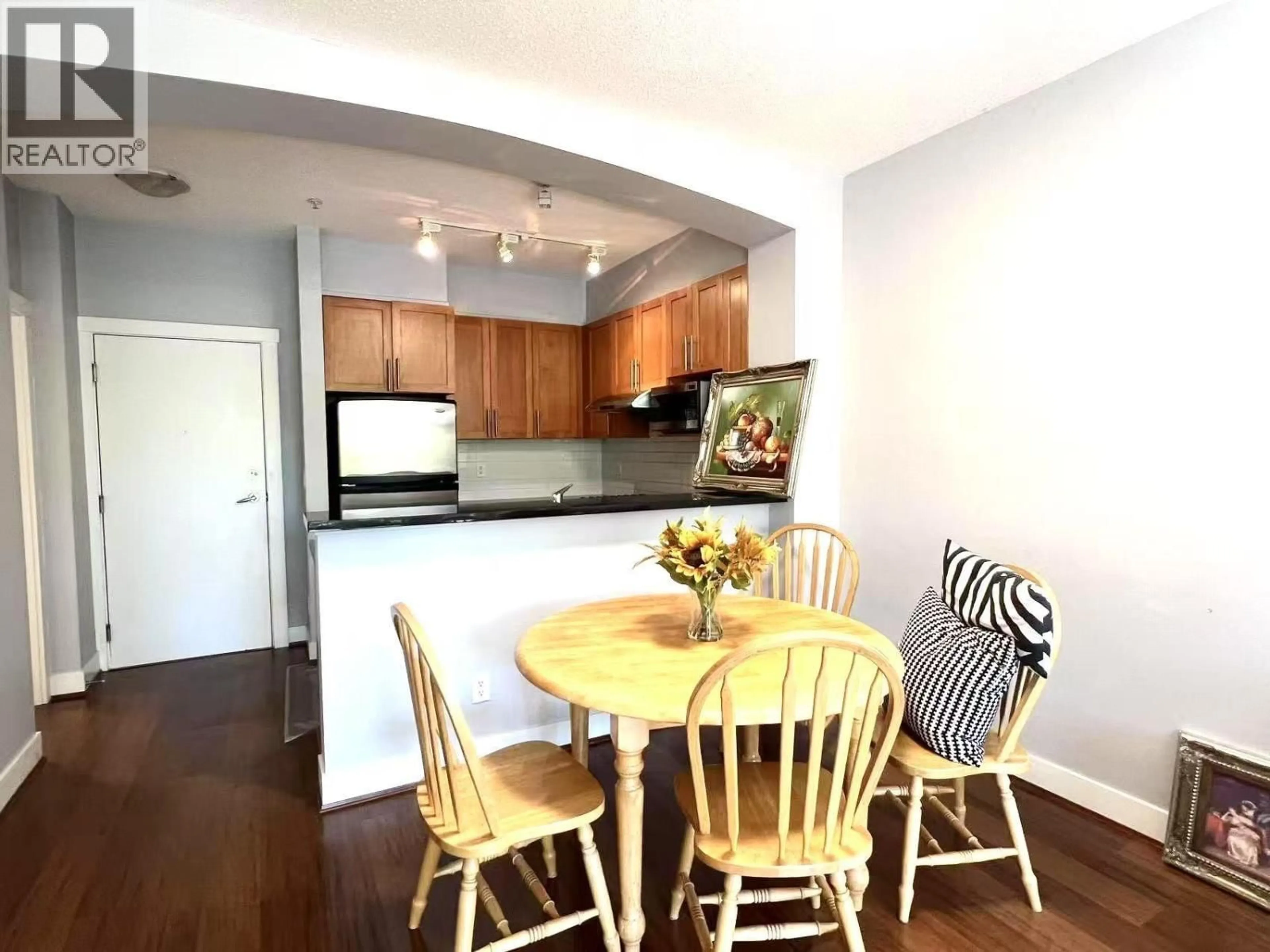 Open concept kitchen, wood/laminate floor for 212 - 2250 WESBROOK MALL, Vancouver British Columbia V6T0A6