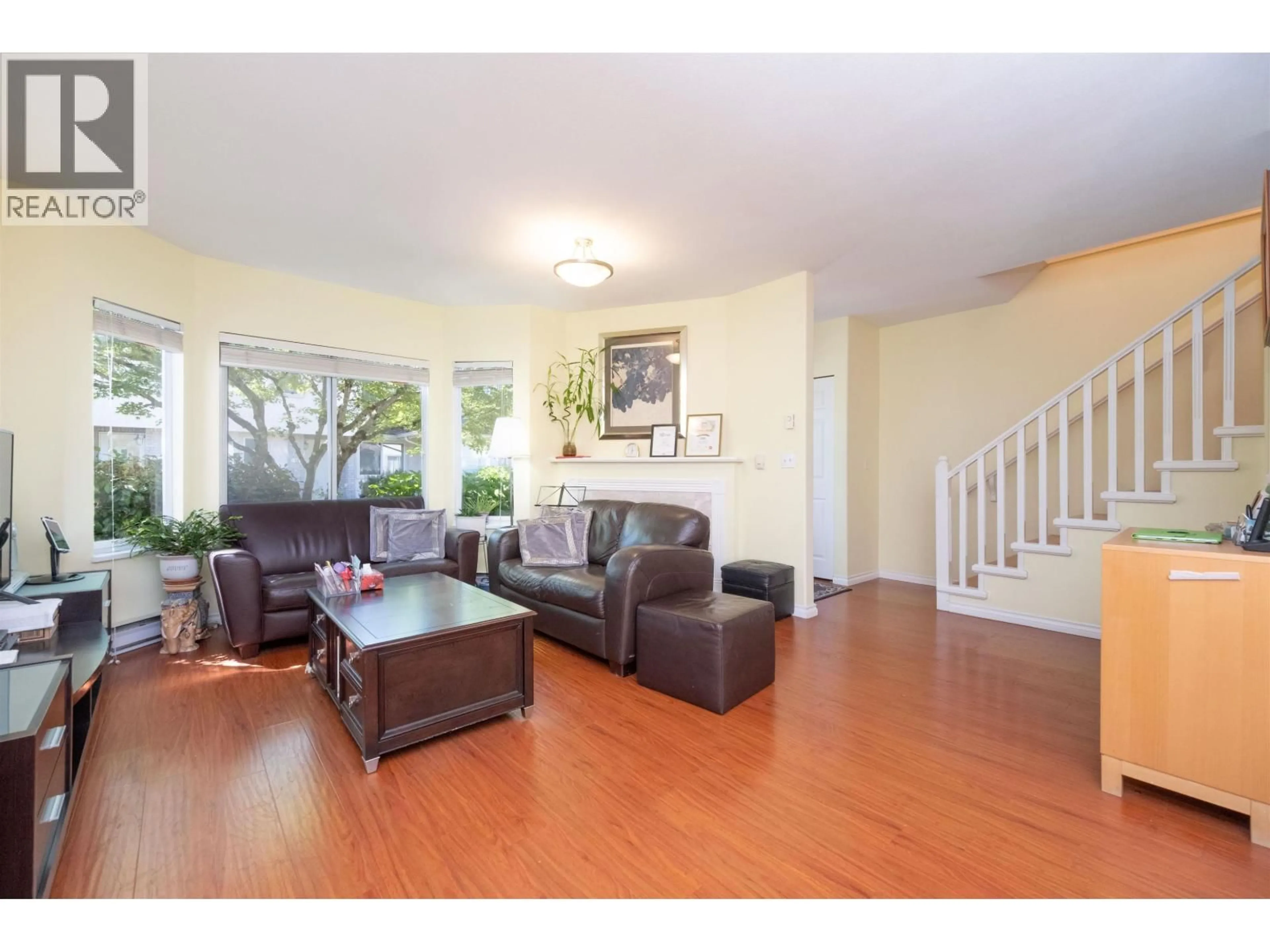Living room with furniture, wood/laminate floor for 35 - 3701 THURSTON STREET, Burnaby British Columbia V5H1H7