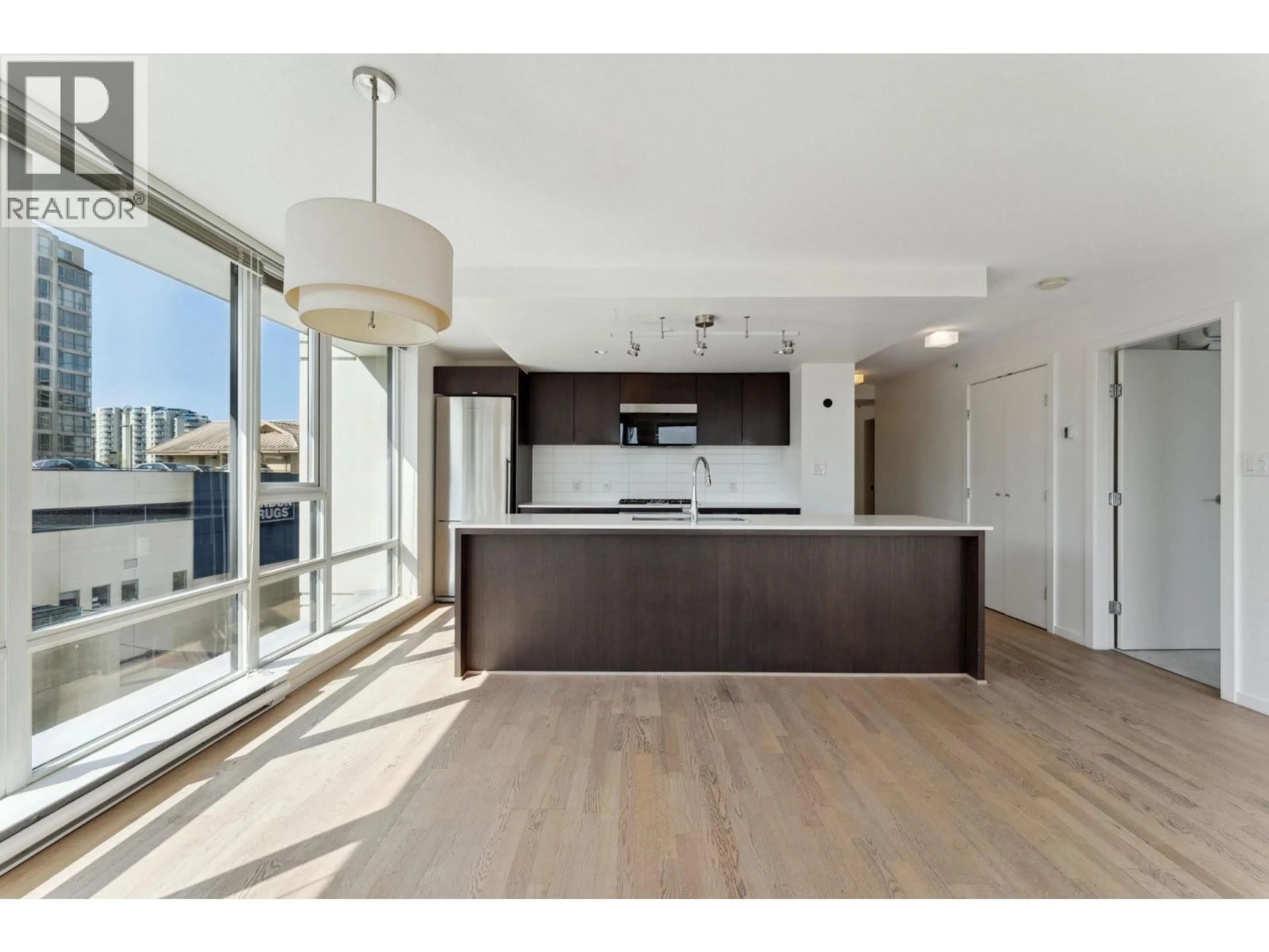 Open concept kitchen, wood/laminate floor for 713 - 7988 ACKROYD ROAD, Richmond British Columbia V6X0K6