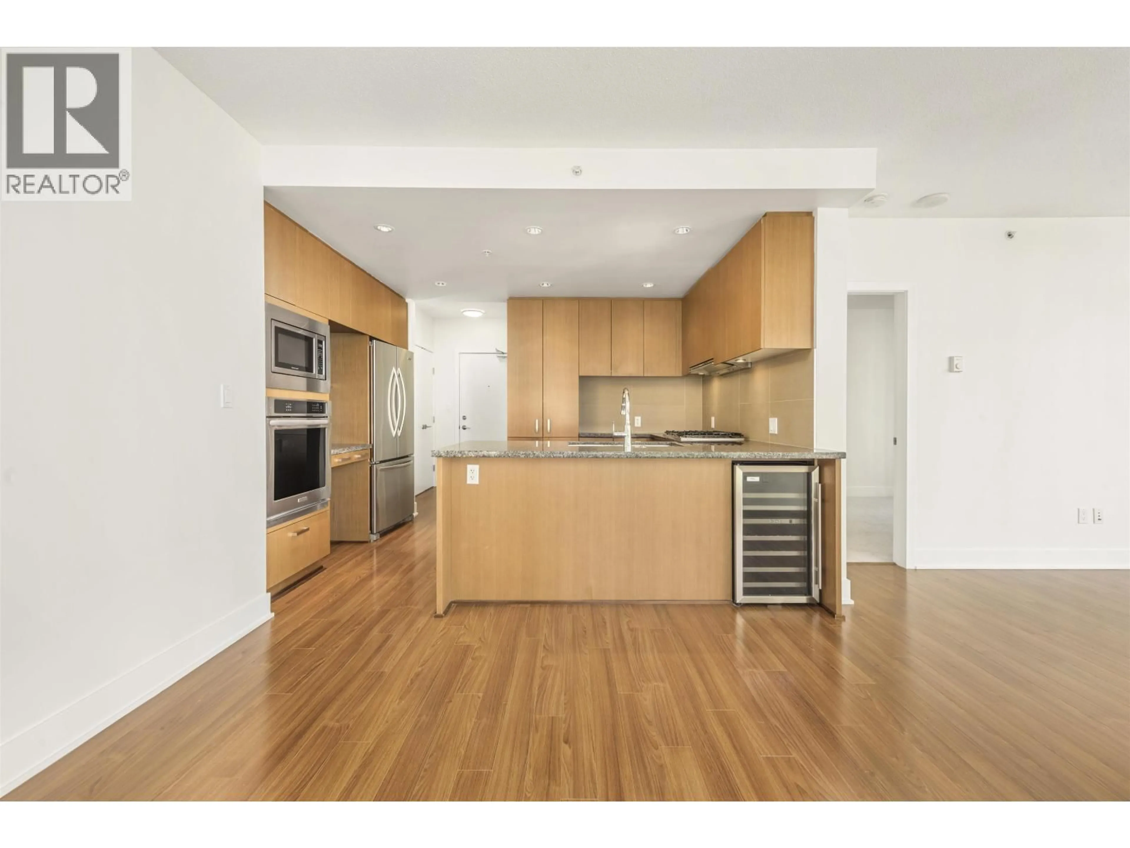 Open concept kitchen, wood/laminate floor for 1002 - 3008 GLEN DRIVE, Coquitlam British Columbia V3B0J5