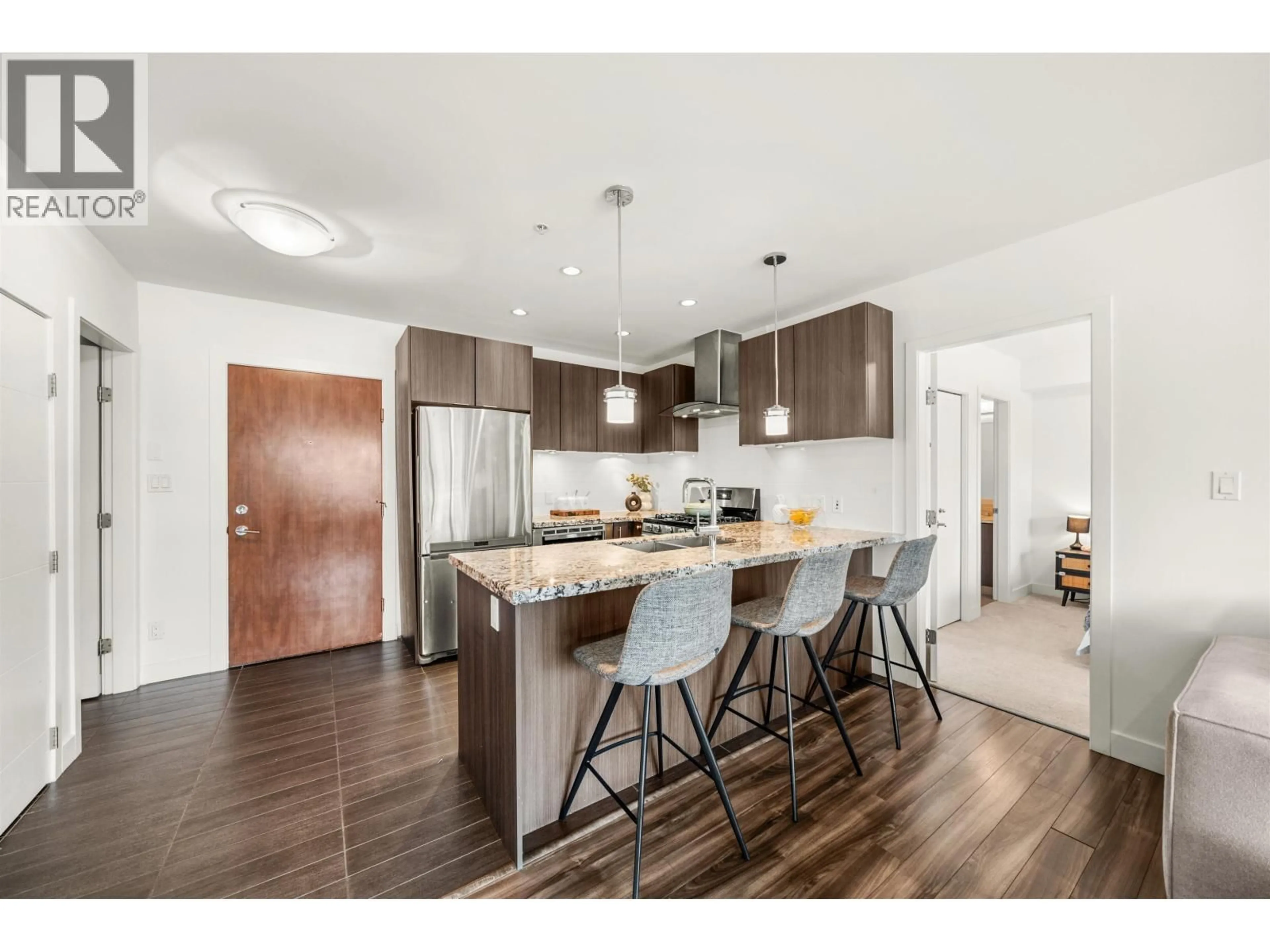 Open concept kitchen, wood/laminate floor for 201 - 5688 HASTINGS STREET, Burnaby British Columbia V5B1R4