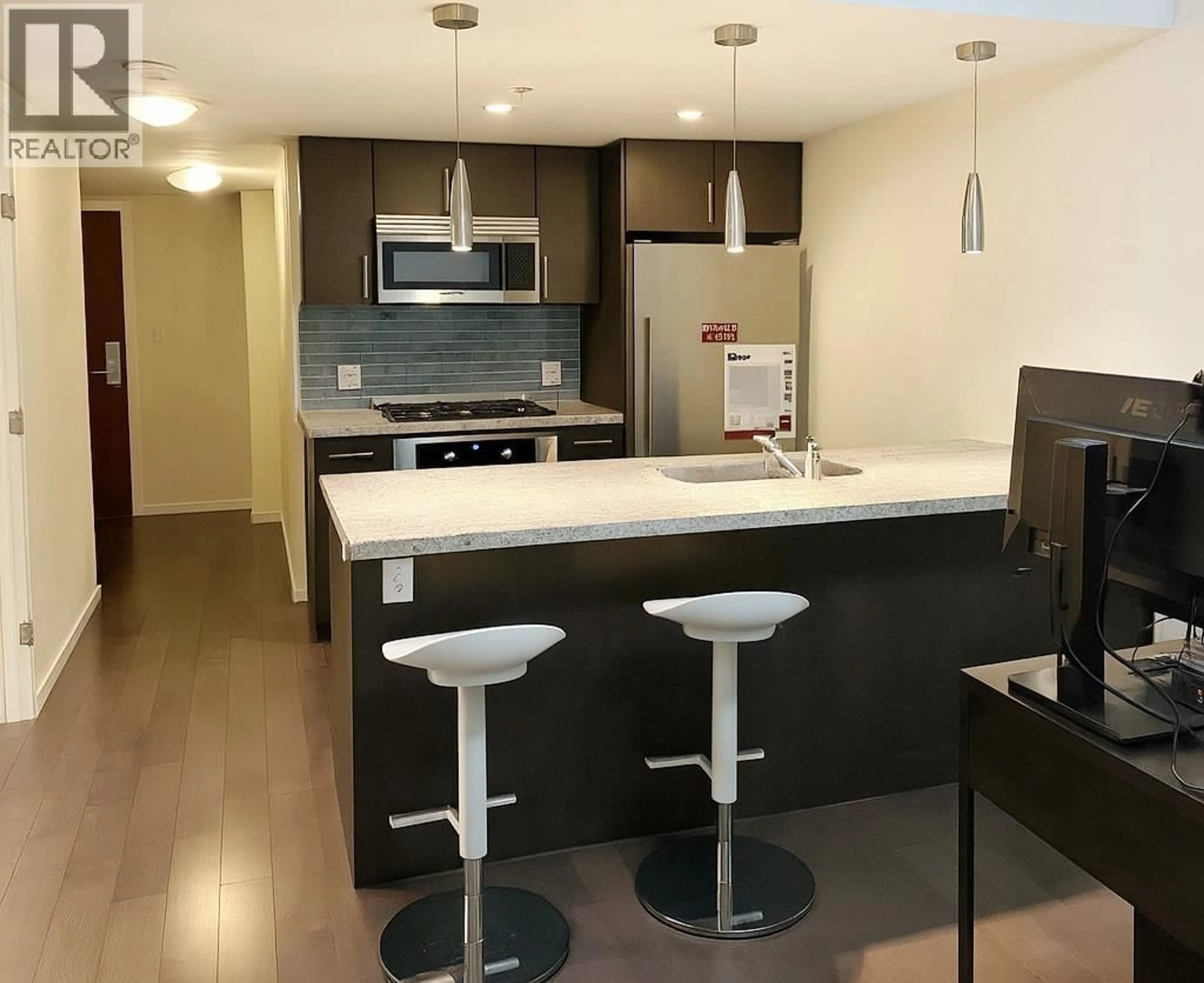 Open concept kitchen, wood/laminate floor for 604 - 89 2ND AVENUE, Vancouver British Columbia V5Y0G9