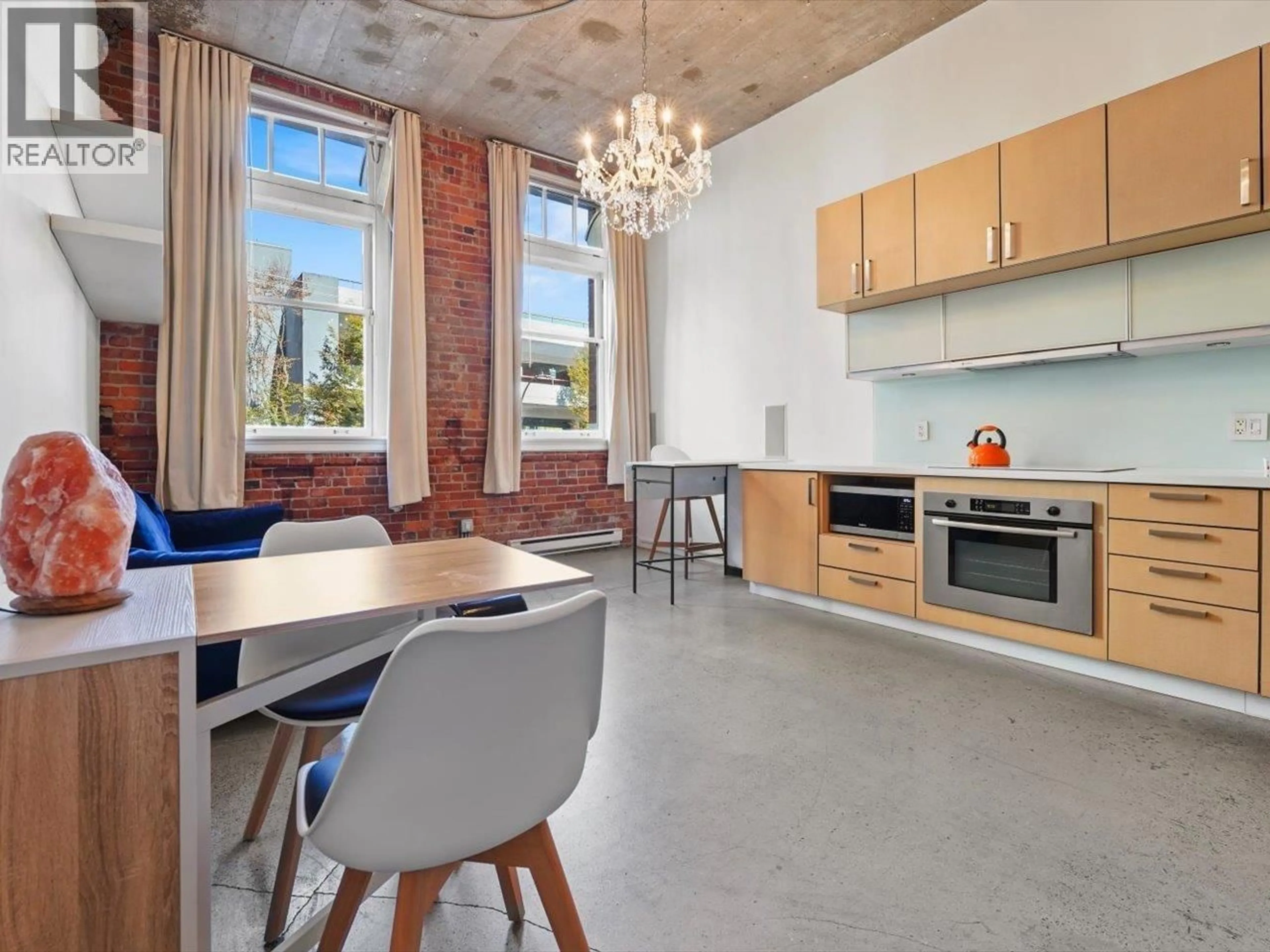 Open concept kitchen, cement floor for 201 - 546 BEATTY STREET, Vancouver British Columbia V6B2L3