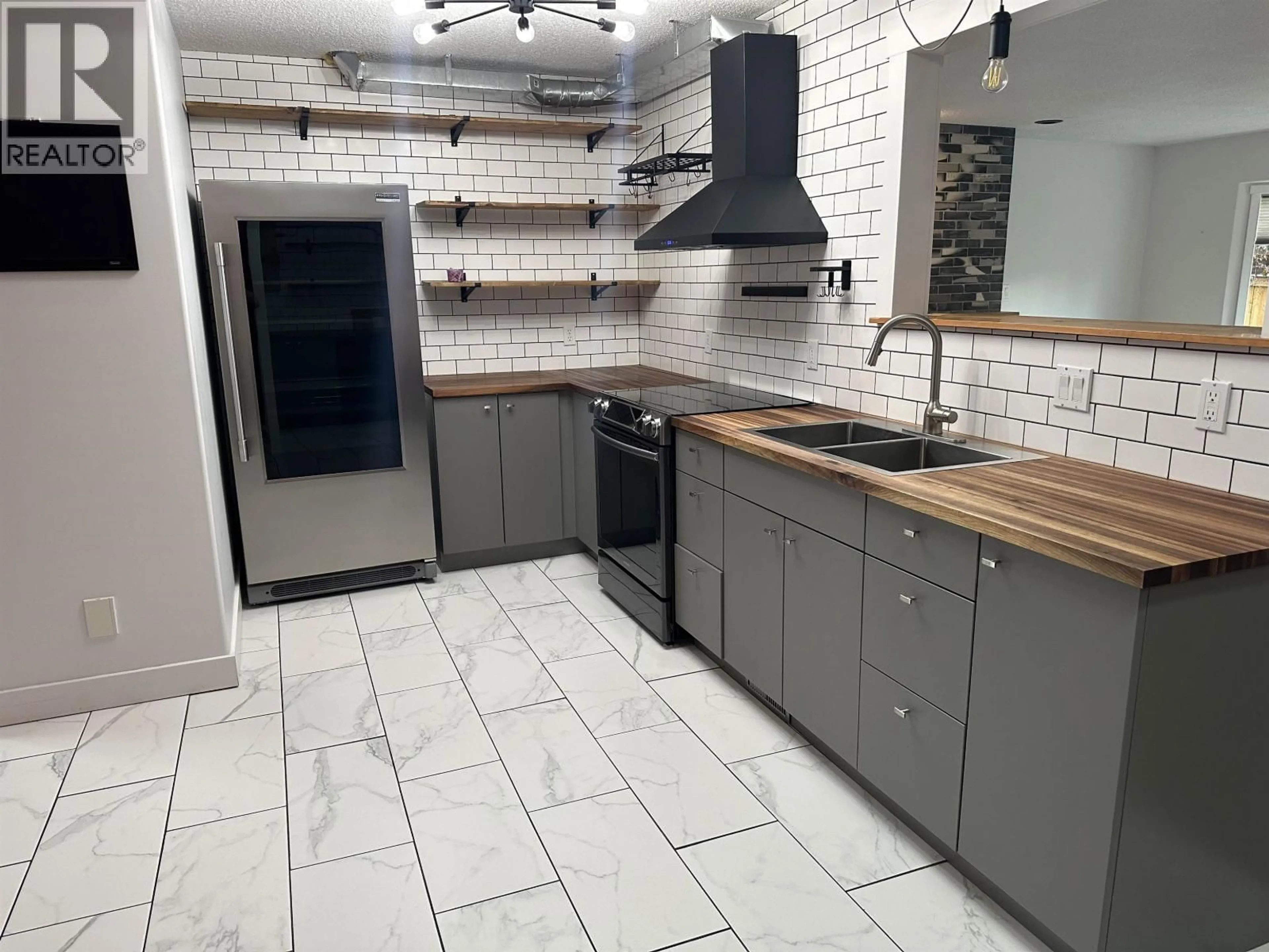 Standard kitchen, ceramic/tile floor for 9917 115 AVENUE, Fort St. John British Columbia V1J6R8