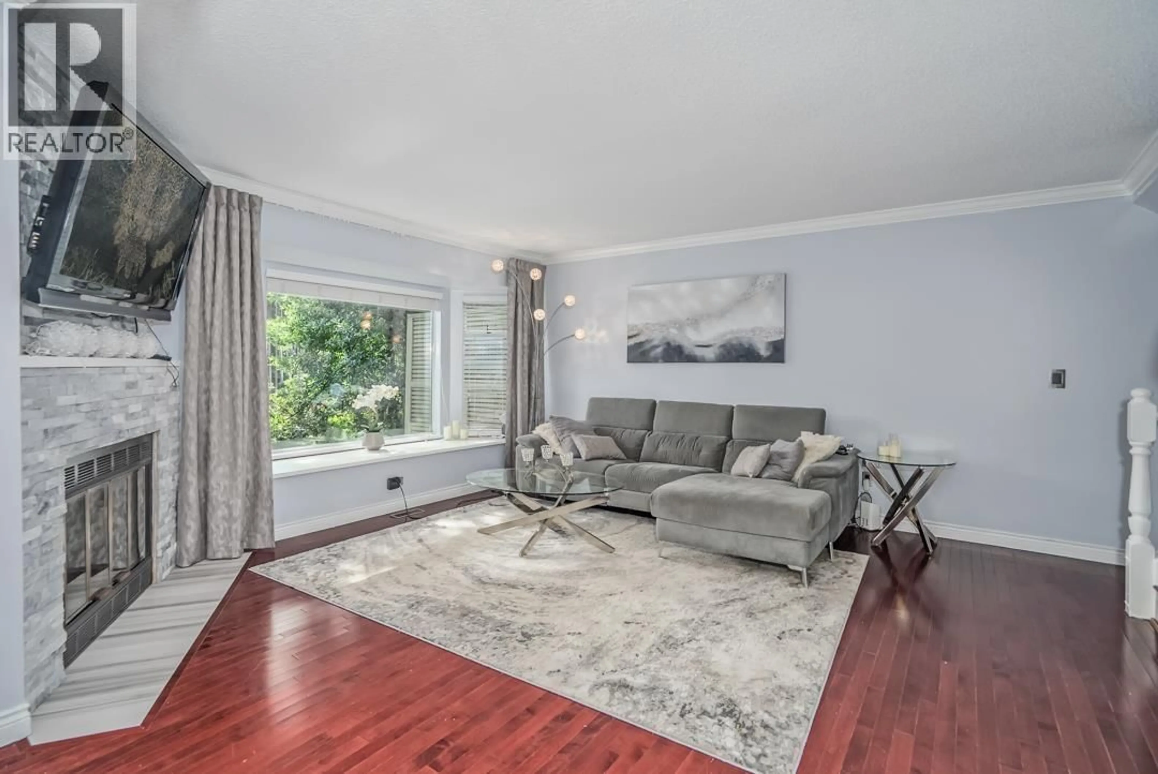 Living room with furniture, wood/laminate floor for 40 - 5740 GARRISON ROAD, Richmond British Columbia V7C5E7
