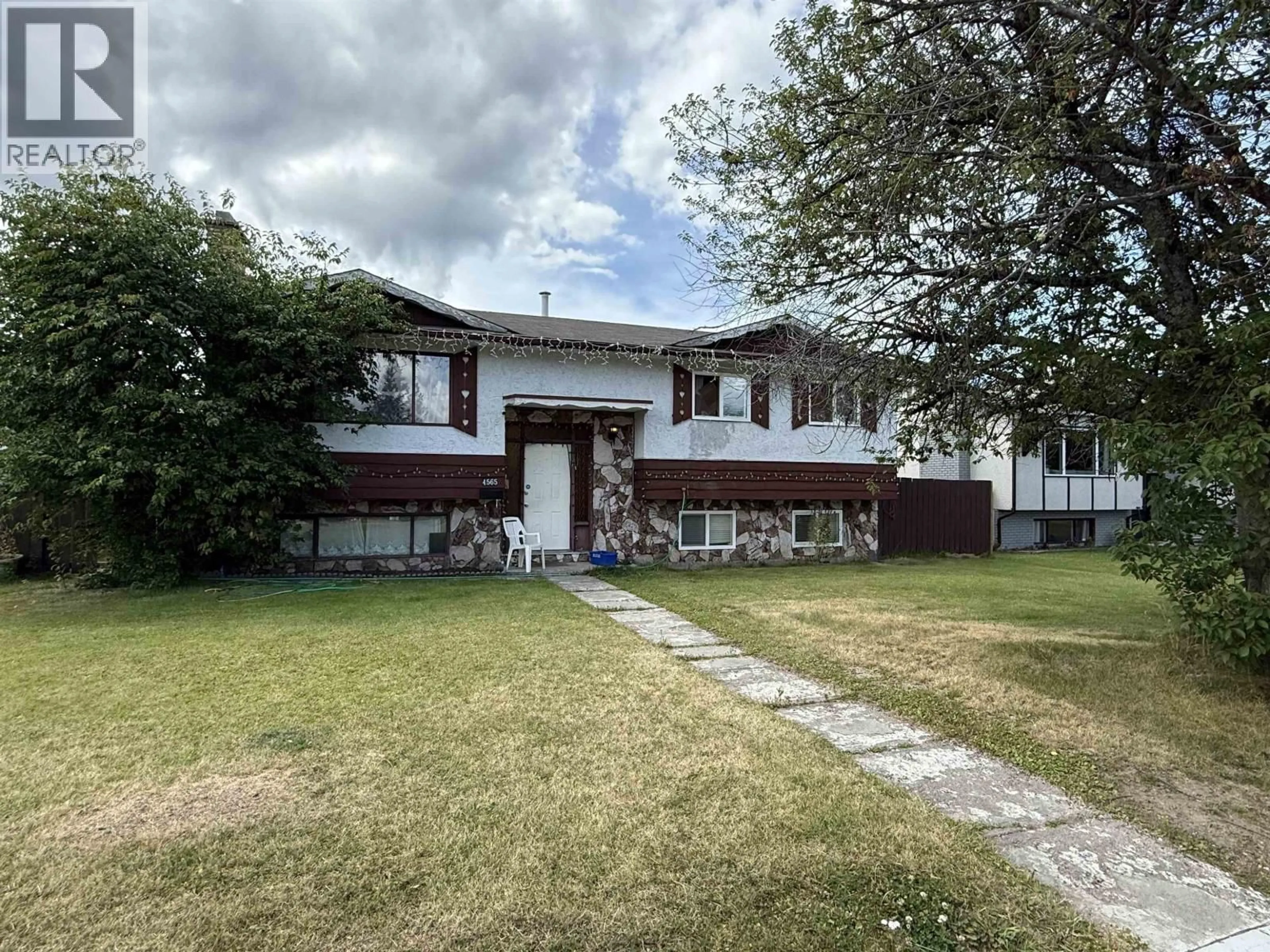 A pic from outside/outdoor area/front of a property/back of a property/a pic from drone, street for 4565 1ST AVENUE, Prince George British Columbia V2M6B4