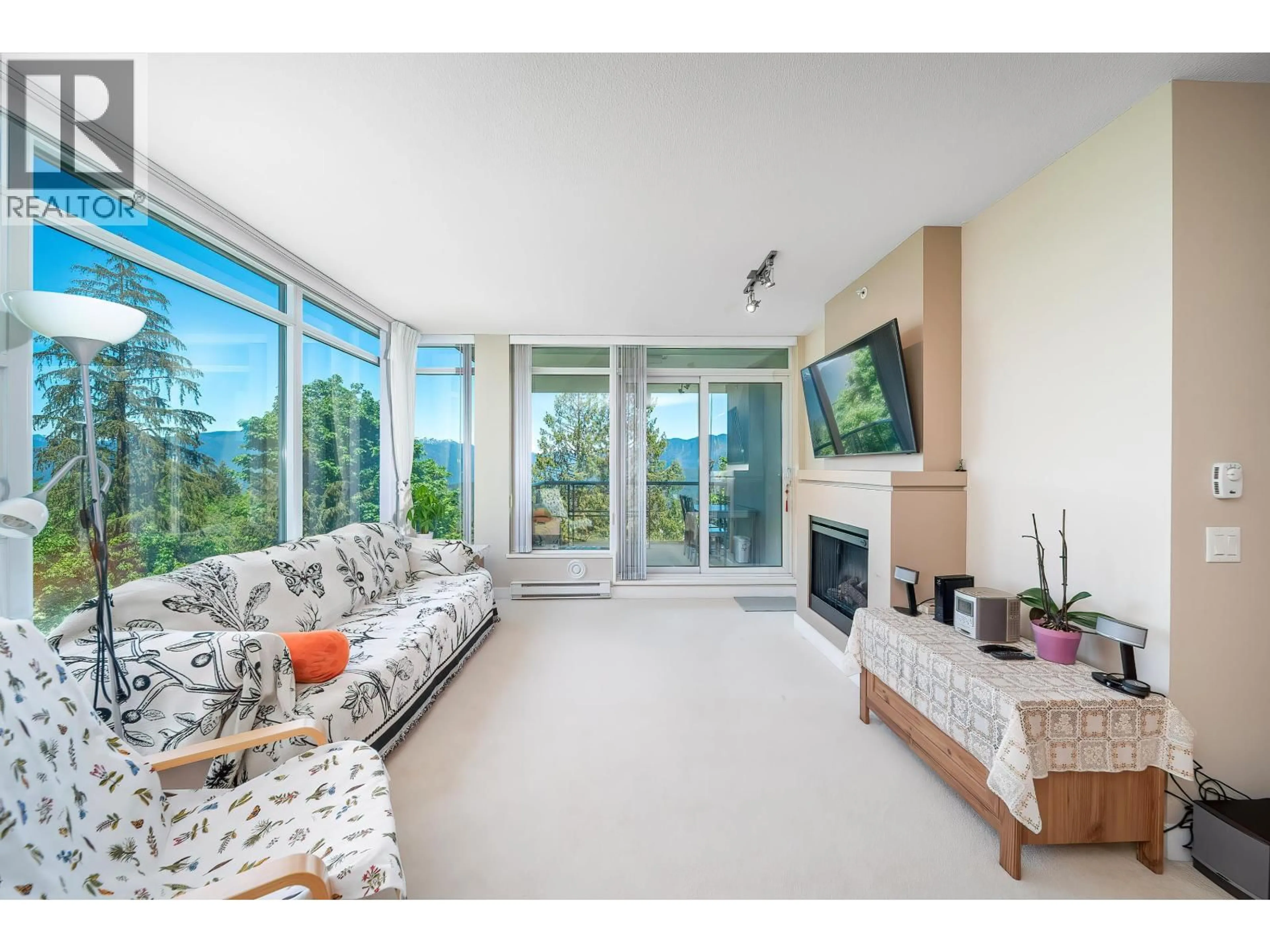 Living room with furniture, unknown for 701 - 9222 UNIVERSITY CRESCENT, Burnaby British Columbia V5A0A6