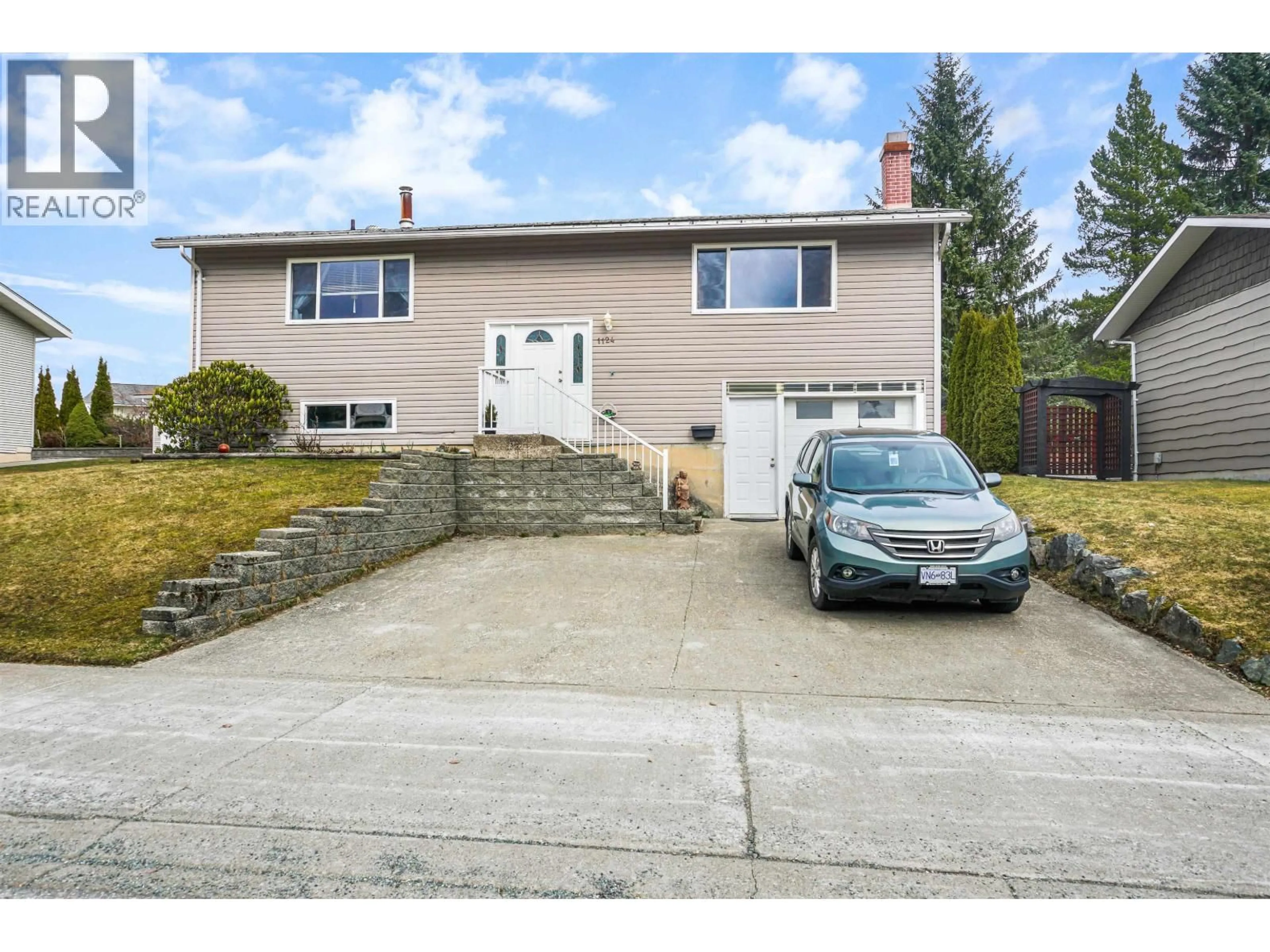 Home with vinyl exterior material, street for 1124 TWEEDSMUIR AVENUE, Kitimat British Columbia V8C1B7
