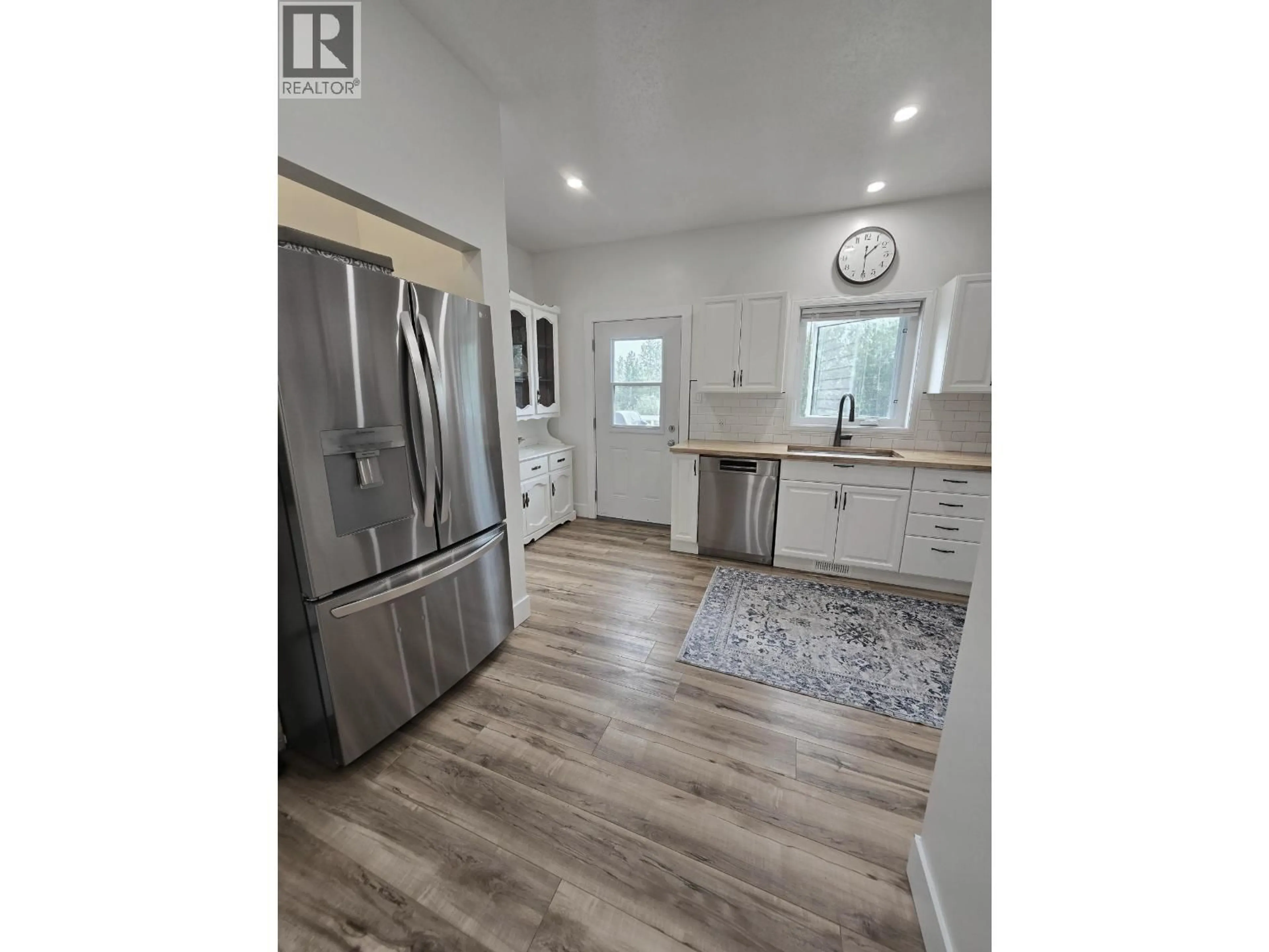 Open concept kitchen, wood/laminate floor for 5203 LEBELL ROAD, Fort St. John British Columbia V1G0J4