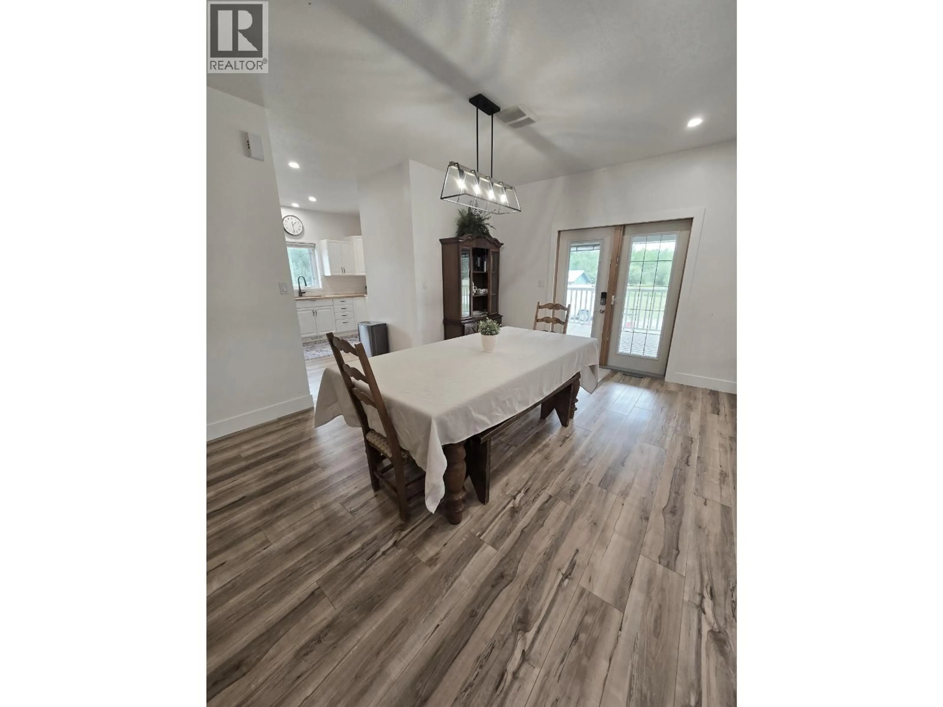 Dining room, wood/laminate floor for 5203 LEBELL ROAD, Fort St. John British Columbia V1G0J4