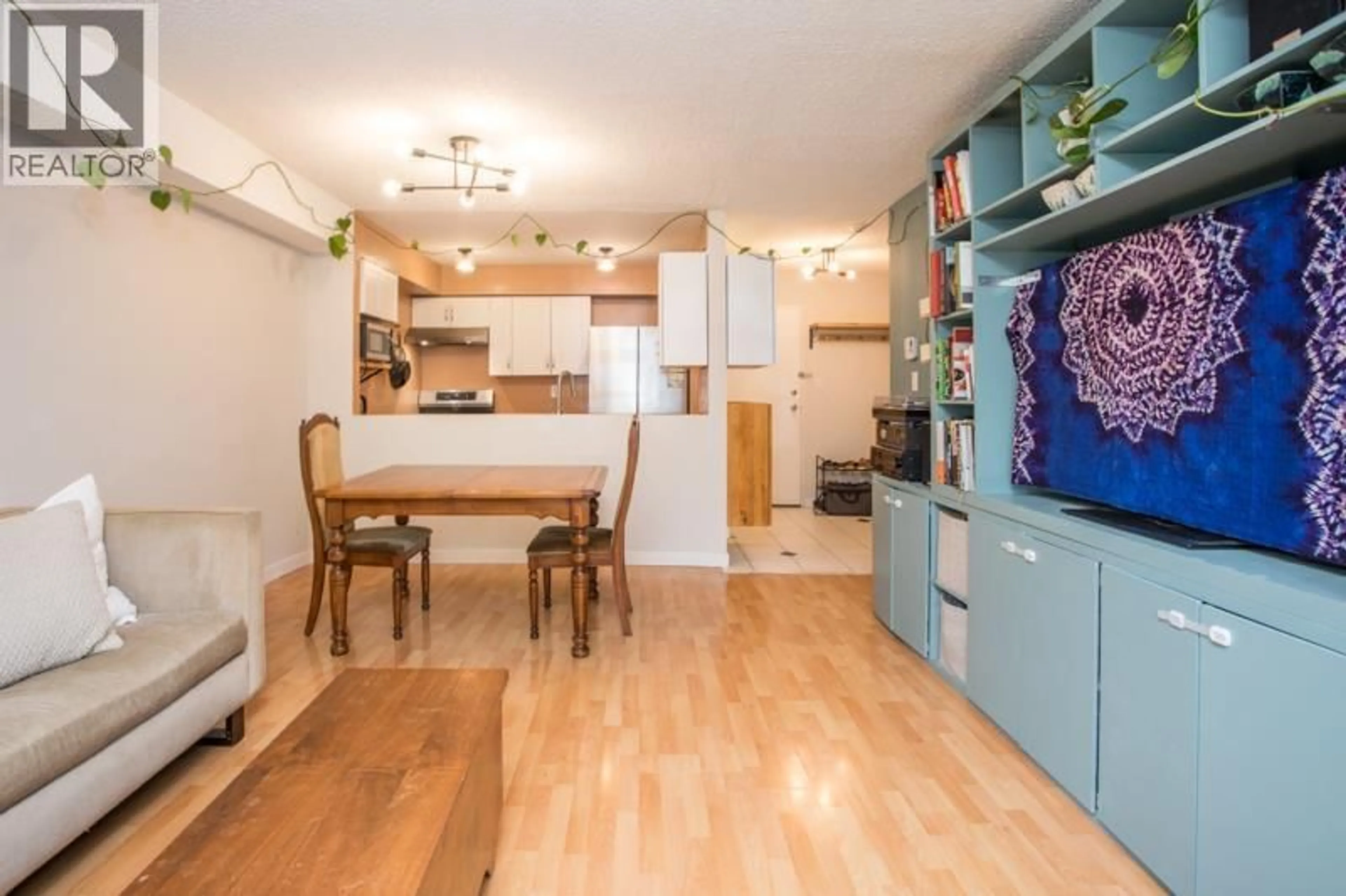 Open concept kitchen, wood/laminate floor for 106 - 1040 BROADWAY STREET, Vancouver British Columbia V5T4N7