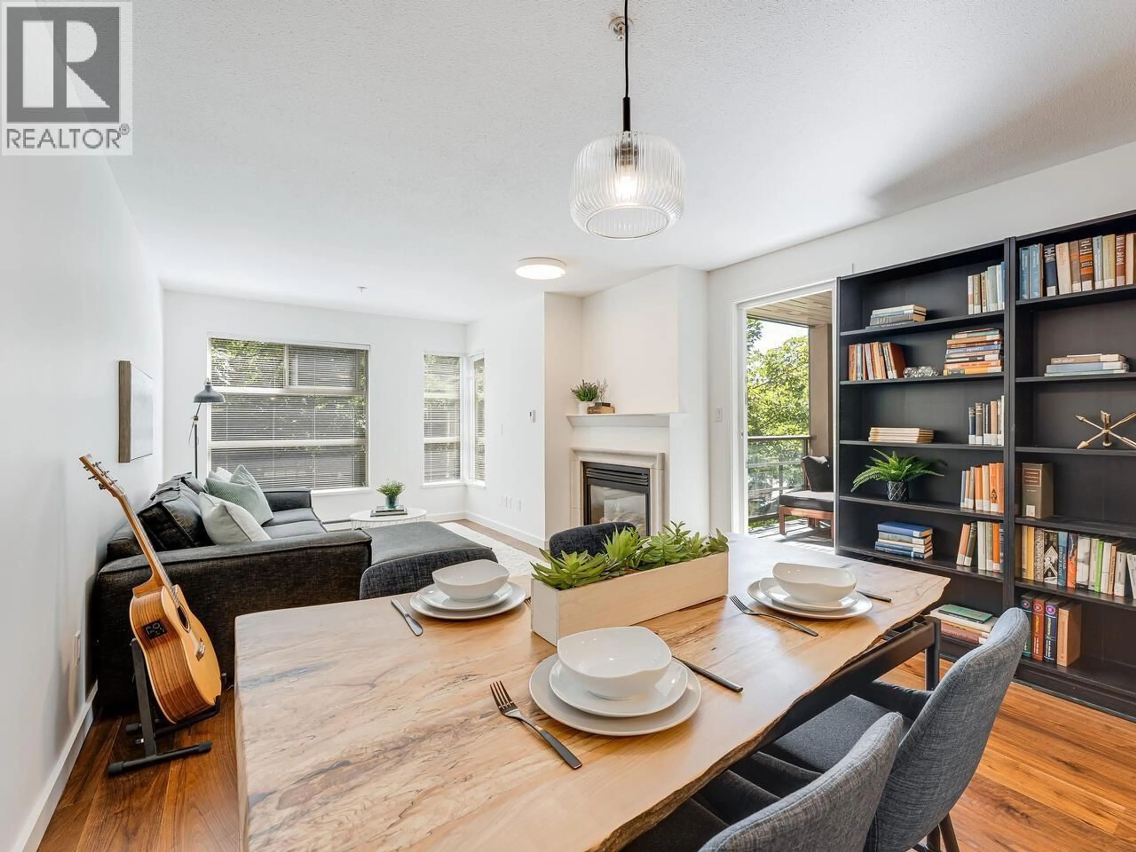 Living room with furniture, wood/laminate floor for 204 - 2181 12TH AVENUE, Vancouver British Columbia V6K4S8