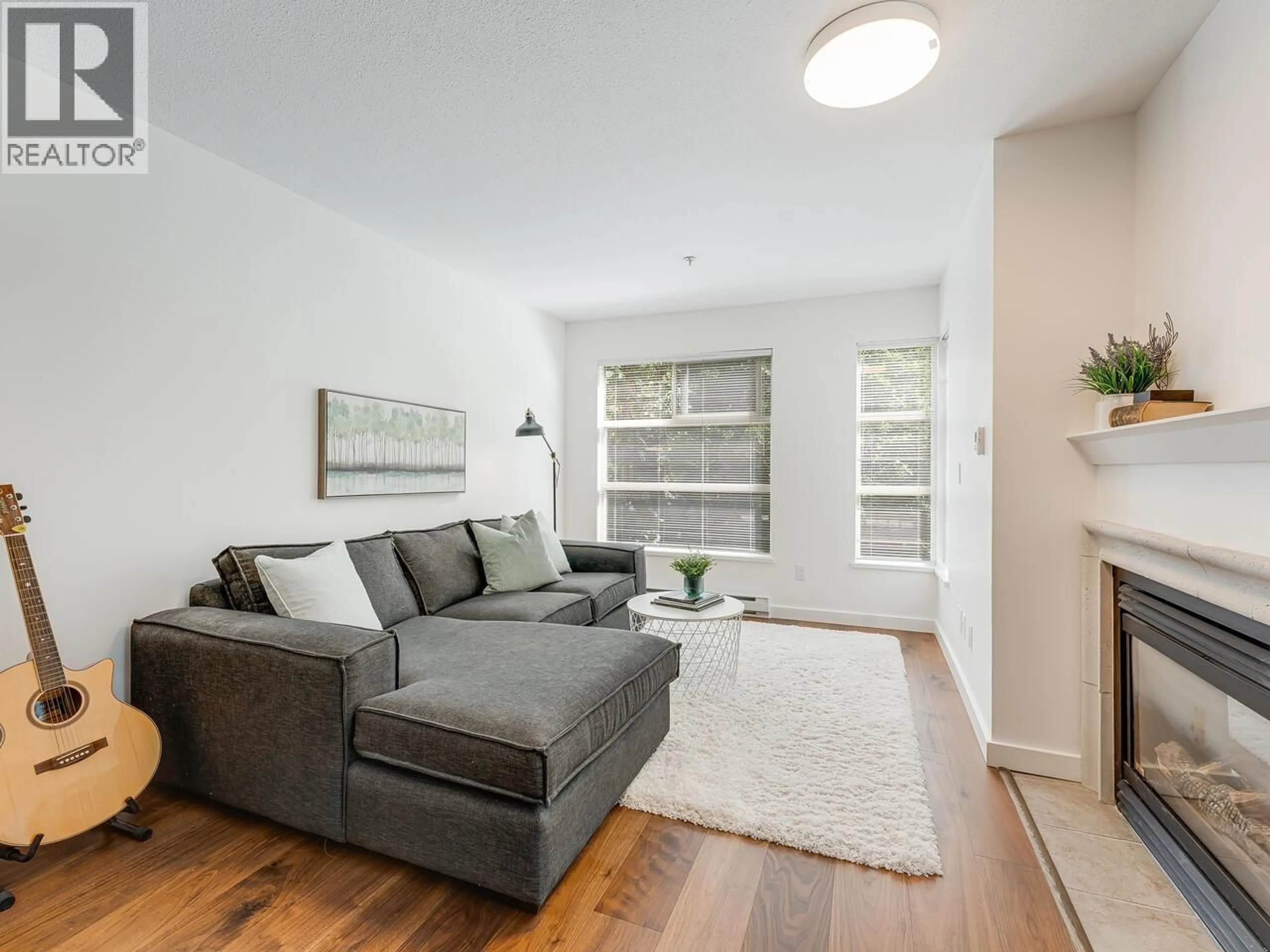 Living room with furniture, wood/laminate floor for 204 - 2181 12TH AVENUE, Vancouver British Columbia V6K4S8