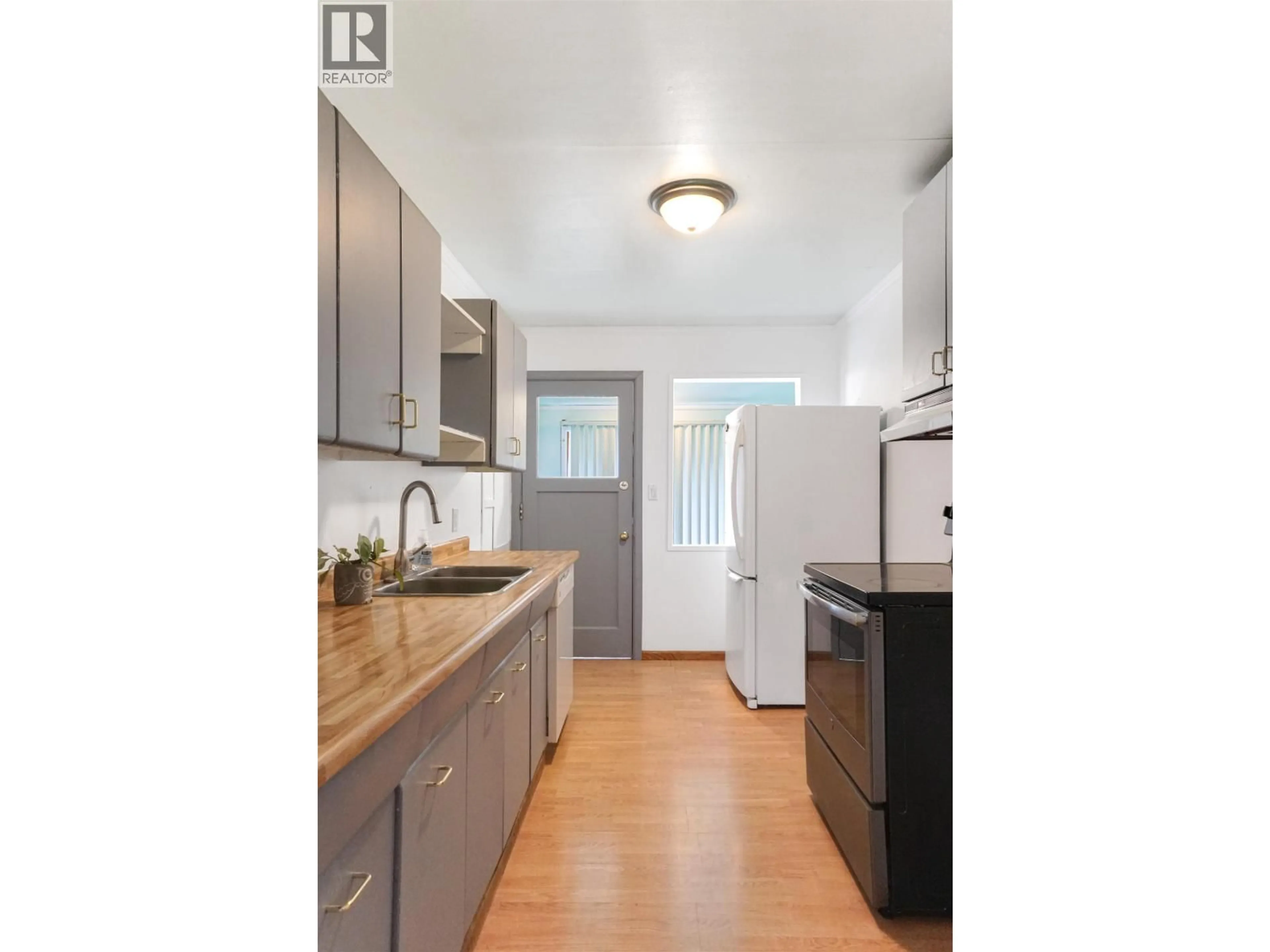 Standard kitchen, wood/laminate floor for 15 HERON STREET, Kitimat British Columbia V8C1N3