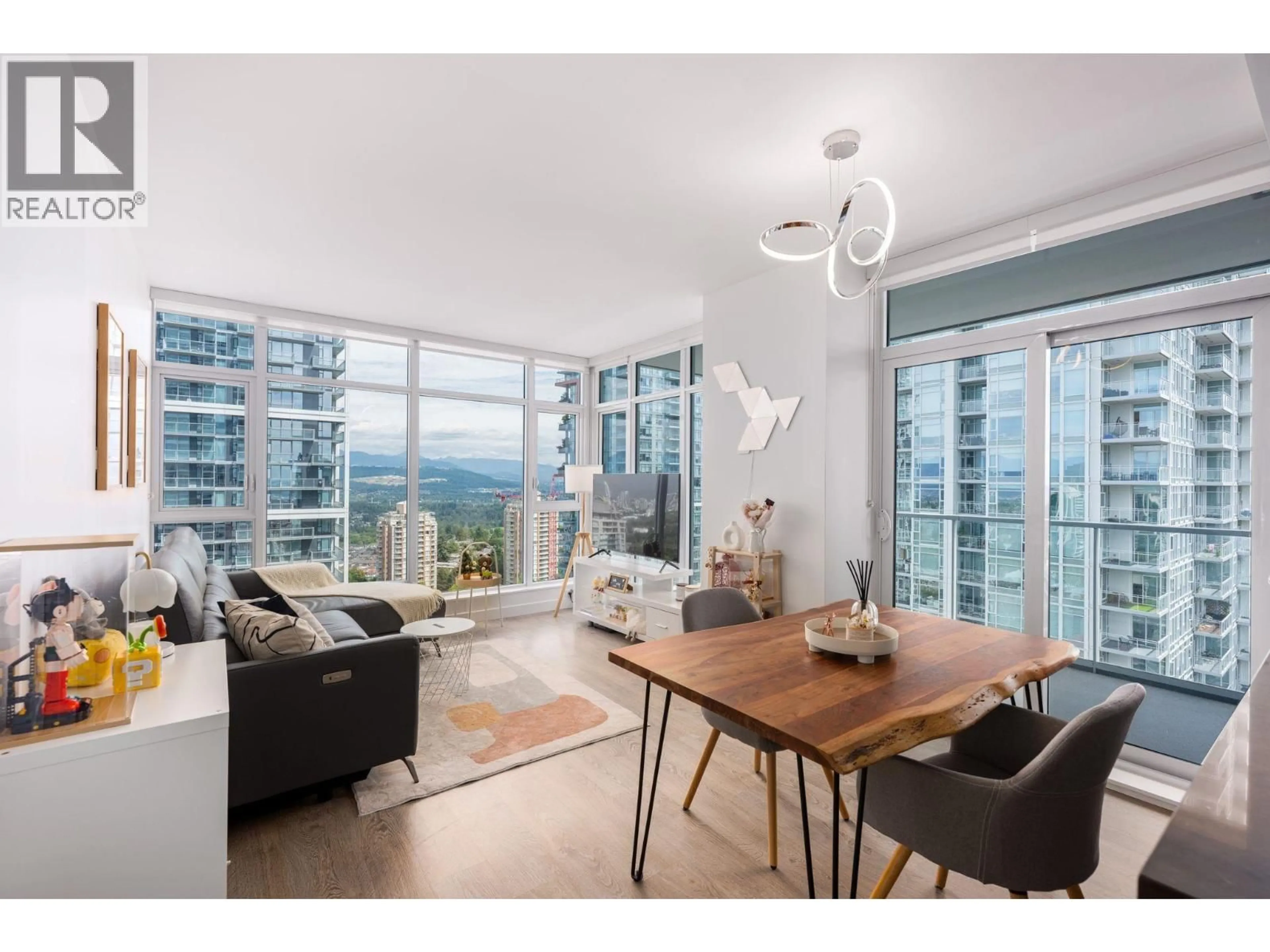 Living room with furniture, wood/laminate floor for 2107 - 6080 MCKAY AVENUE, Burnaby British Columbia V5H0J4