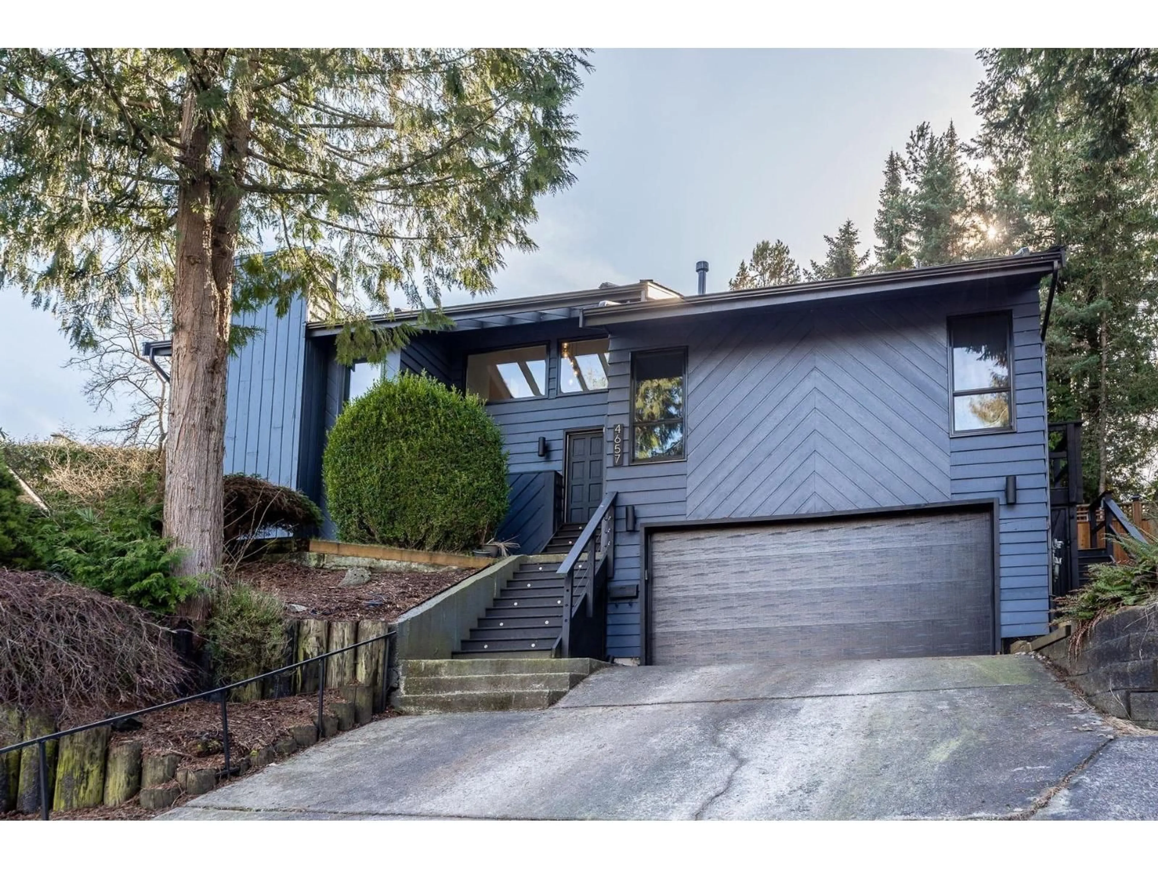 Home with vinyl exterior material, street for 4657 208A, Langley British Columbia V3A7E5