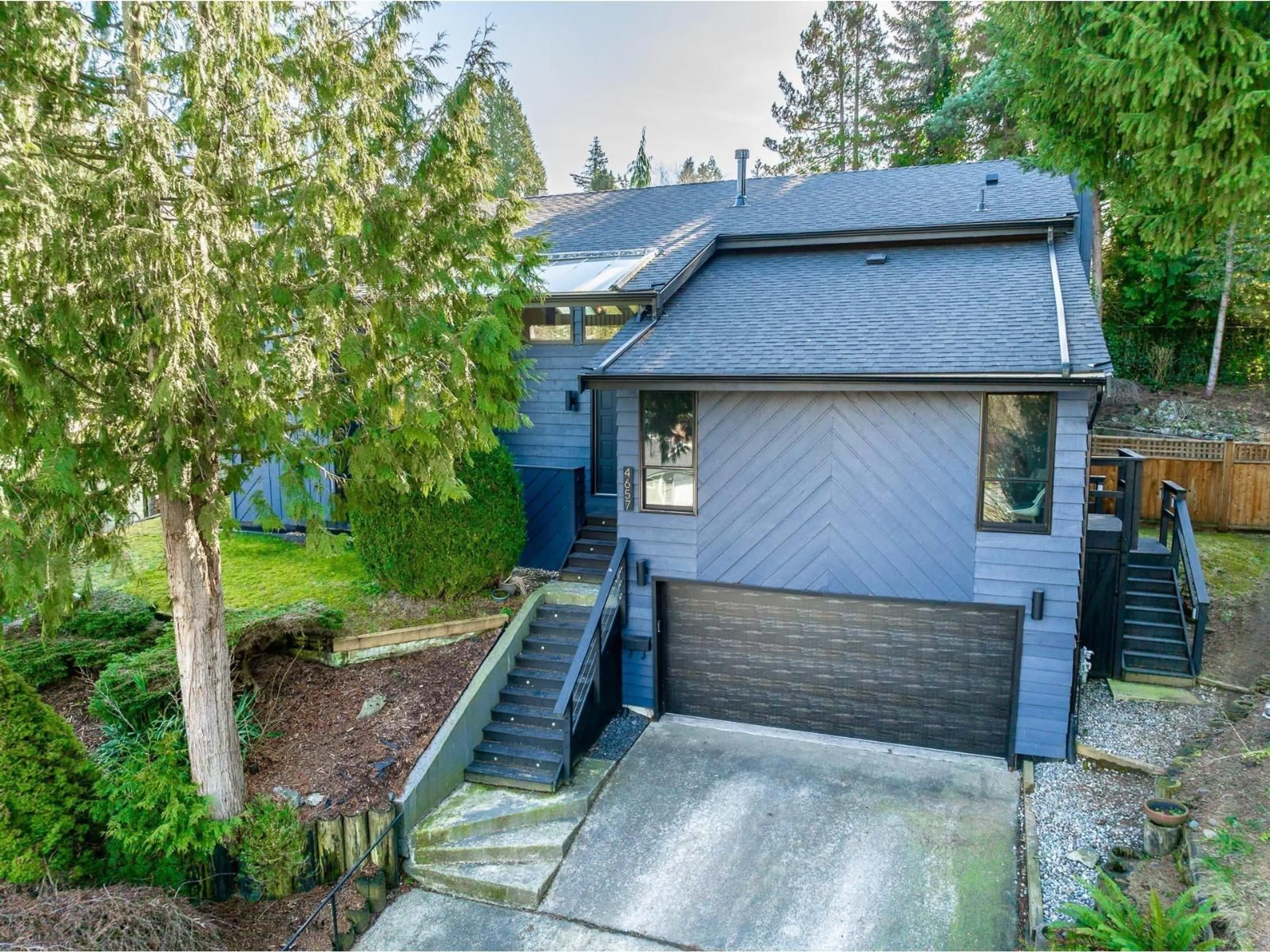 A pic from outside/outdoor area/front of a property/back of a property/a pic from drone, street for 4657 208A, Langley British Columbia V3A7E5