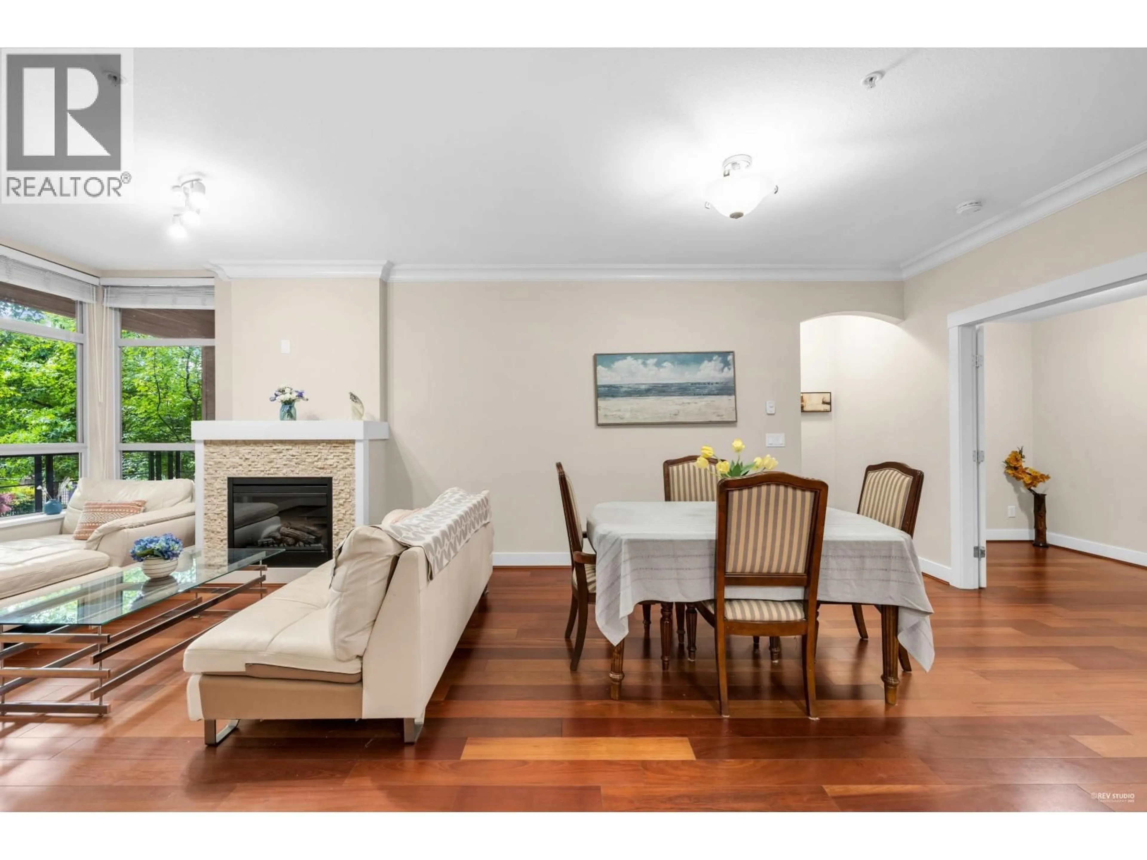 Living room with furniture, wood/laminate floor for 212 - 6333 LARKIN DRIVE, Vancouver British Columbia V6T0A7