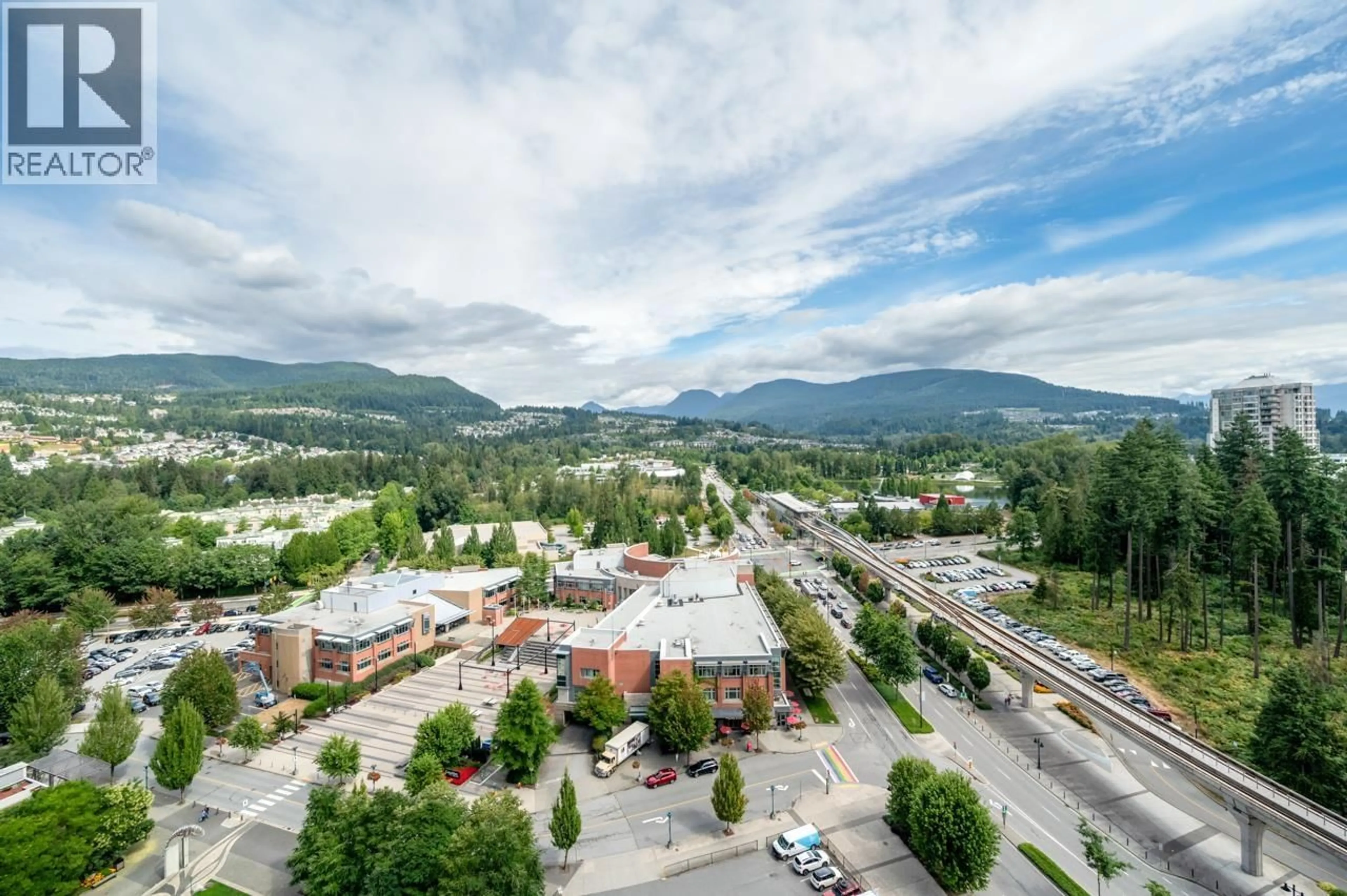A pic from outside/outdoor area/front of a property/back of a property/a pic from drone, mountain view for 2009 - 3007 GLEN DRIVE, Coquitlam British Columbia V3B0L8
