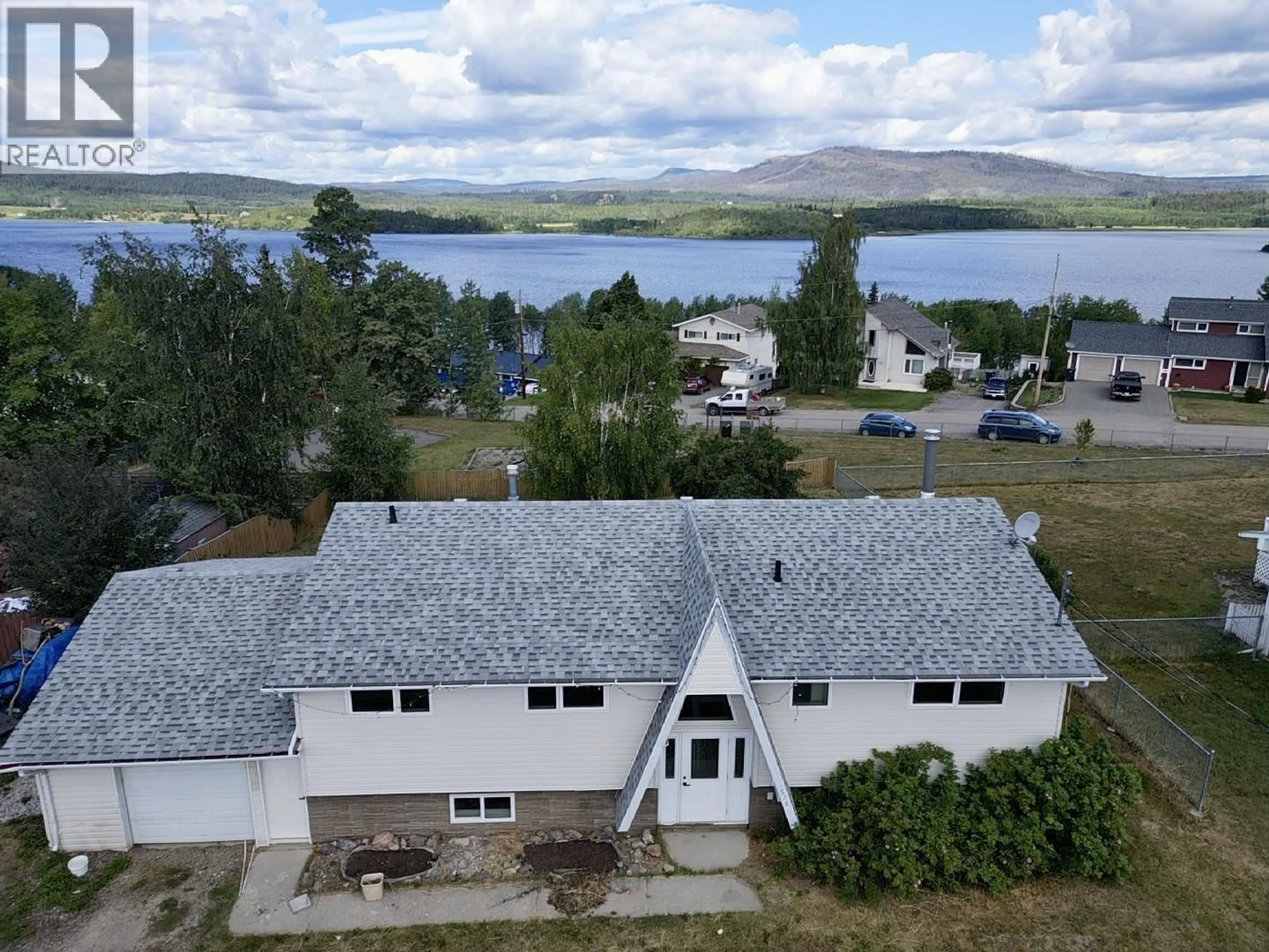 A pic from outside/outdoor area/front of a property/back of a property/a pic from drone, water/lake/river/ocean view for 525 TUNASA DRIVE, Fraser Lake British Columbia V0J1S0