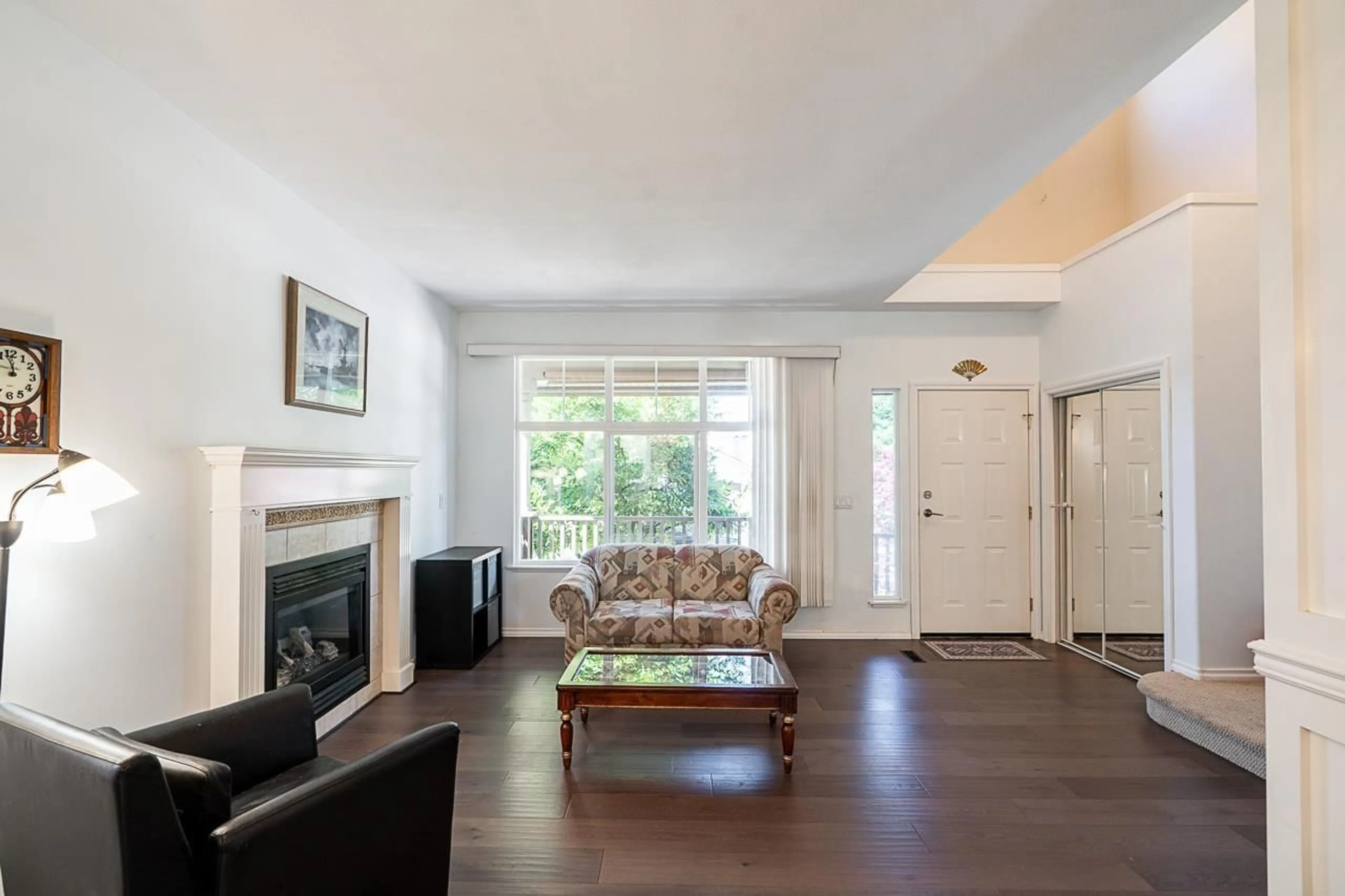 Living room with furniture, wood/laminate floor for 6830 183, Surrey British Columbia V3S9E4