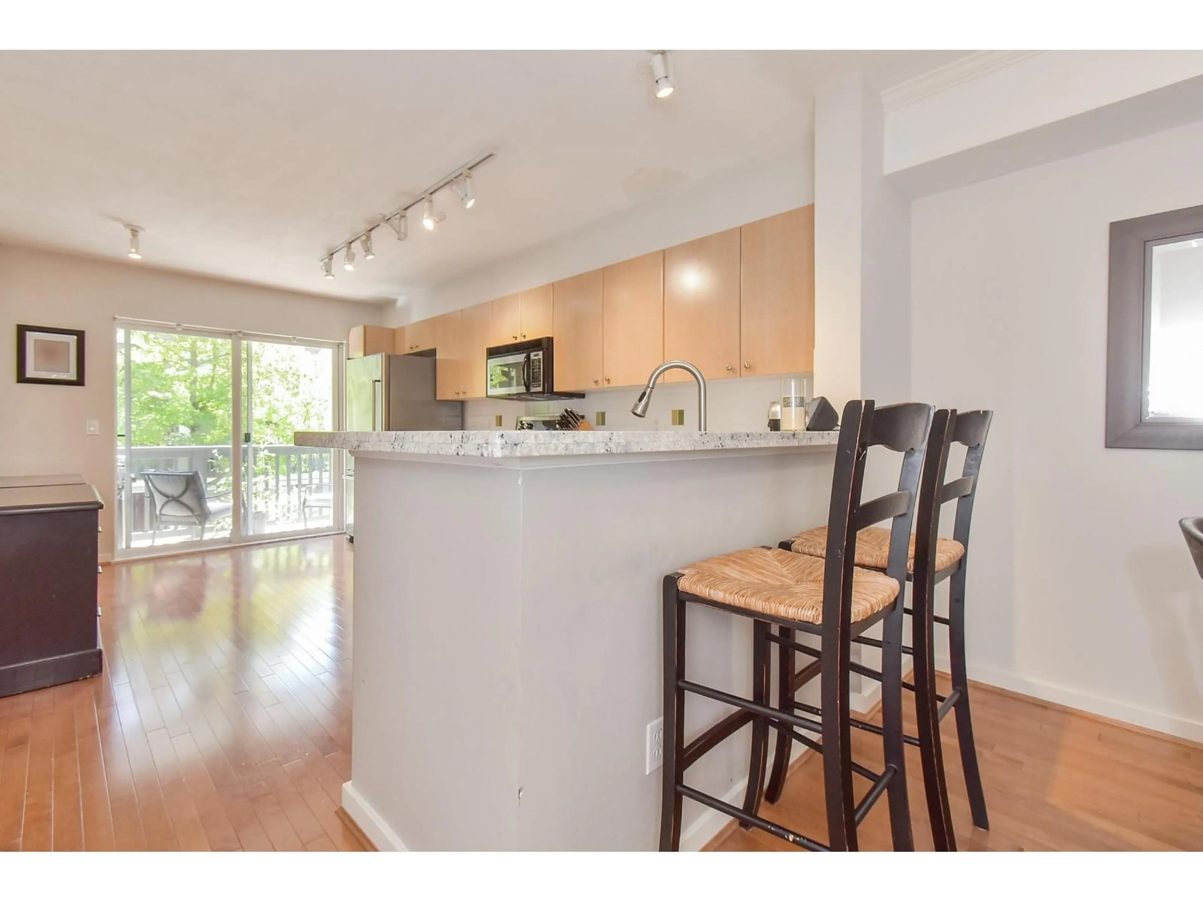 Open concept kitchen, wood/laminate floor for 155 - 15236 36, Surrey British Columbia V3Z2B3