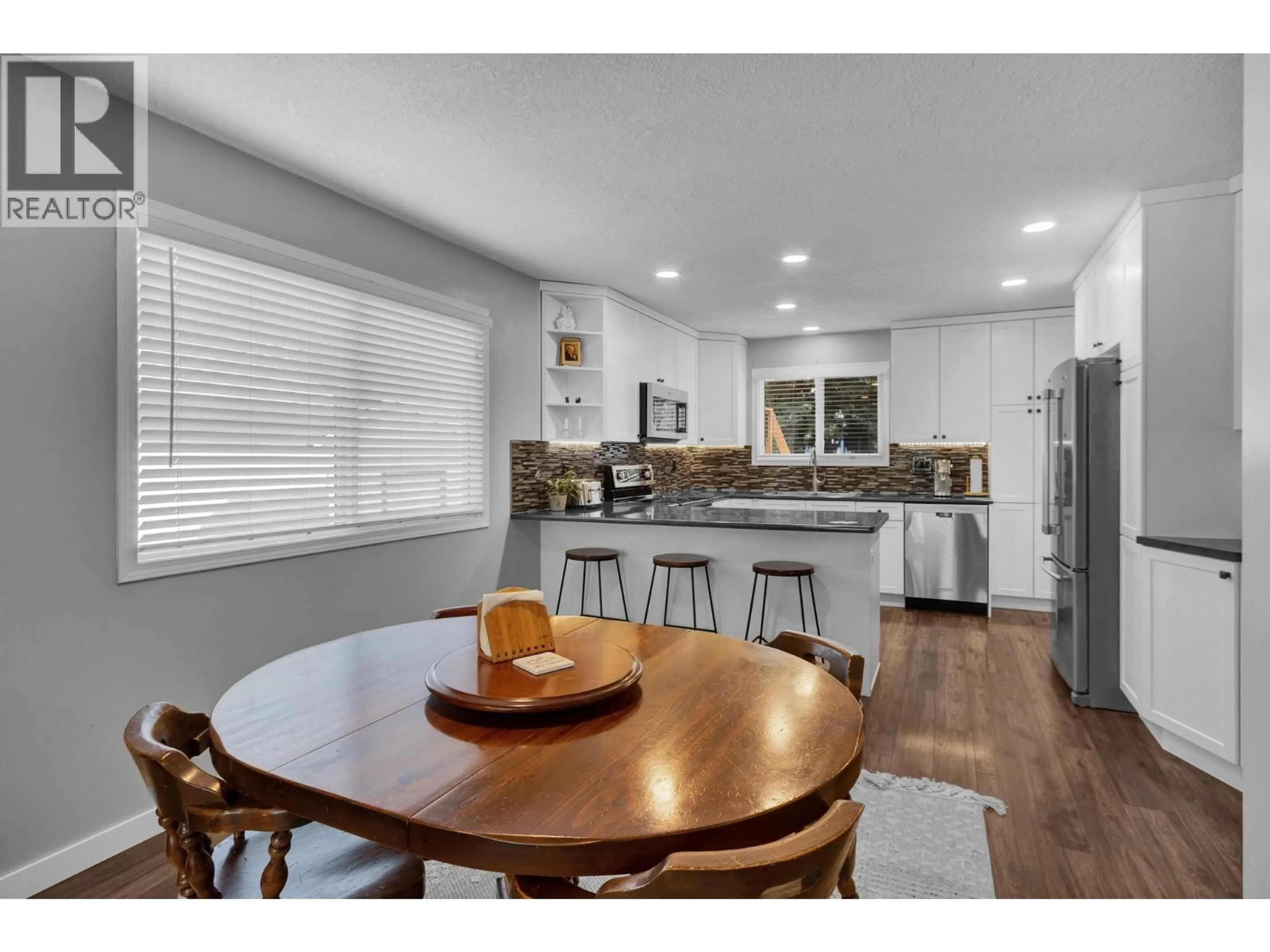 Open concept kitchen, wood/laminate floor for 7725 KINGSLEY CRESCENT, Prince George British Columbia V2N3M9