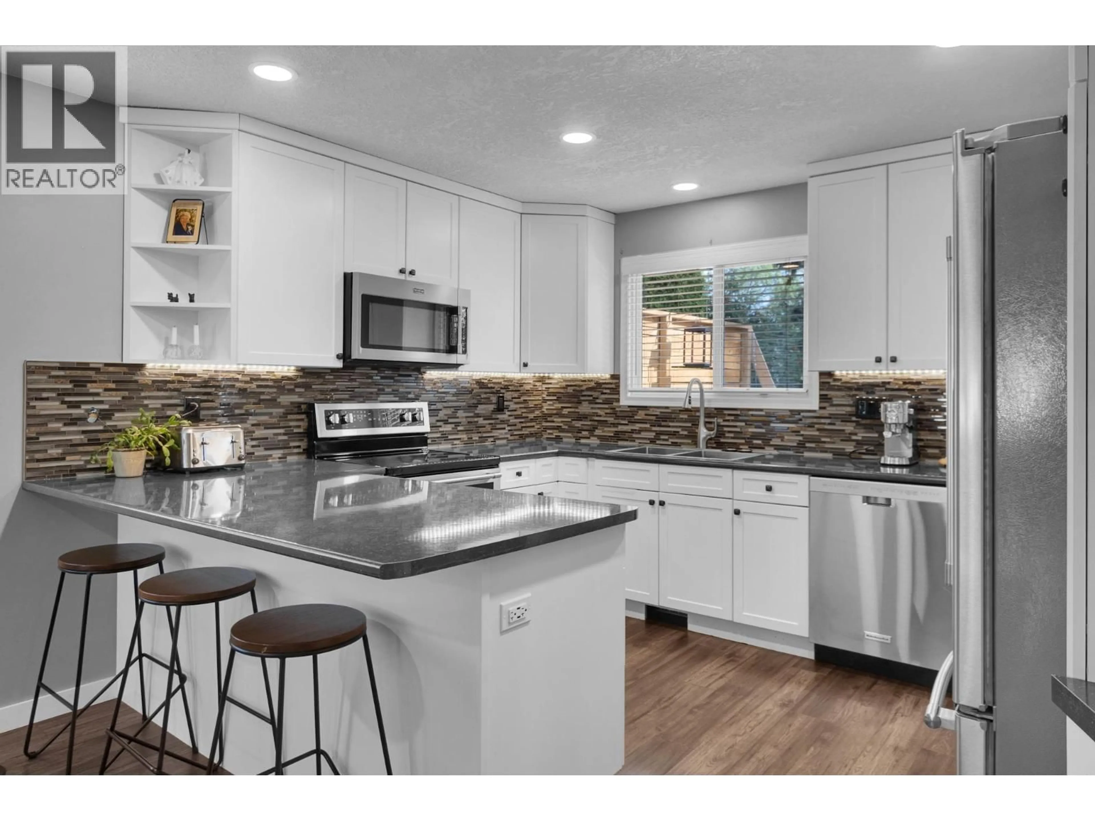 Open concept kitchen, ceramic/tile floor for 7725 KINGSLEY CRESCENT, Prince George British Columbia V2N3M9
