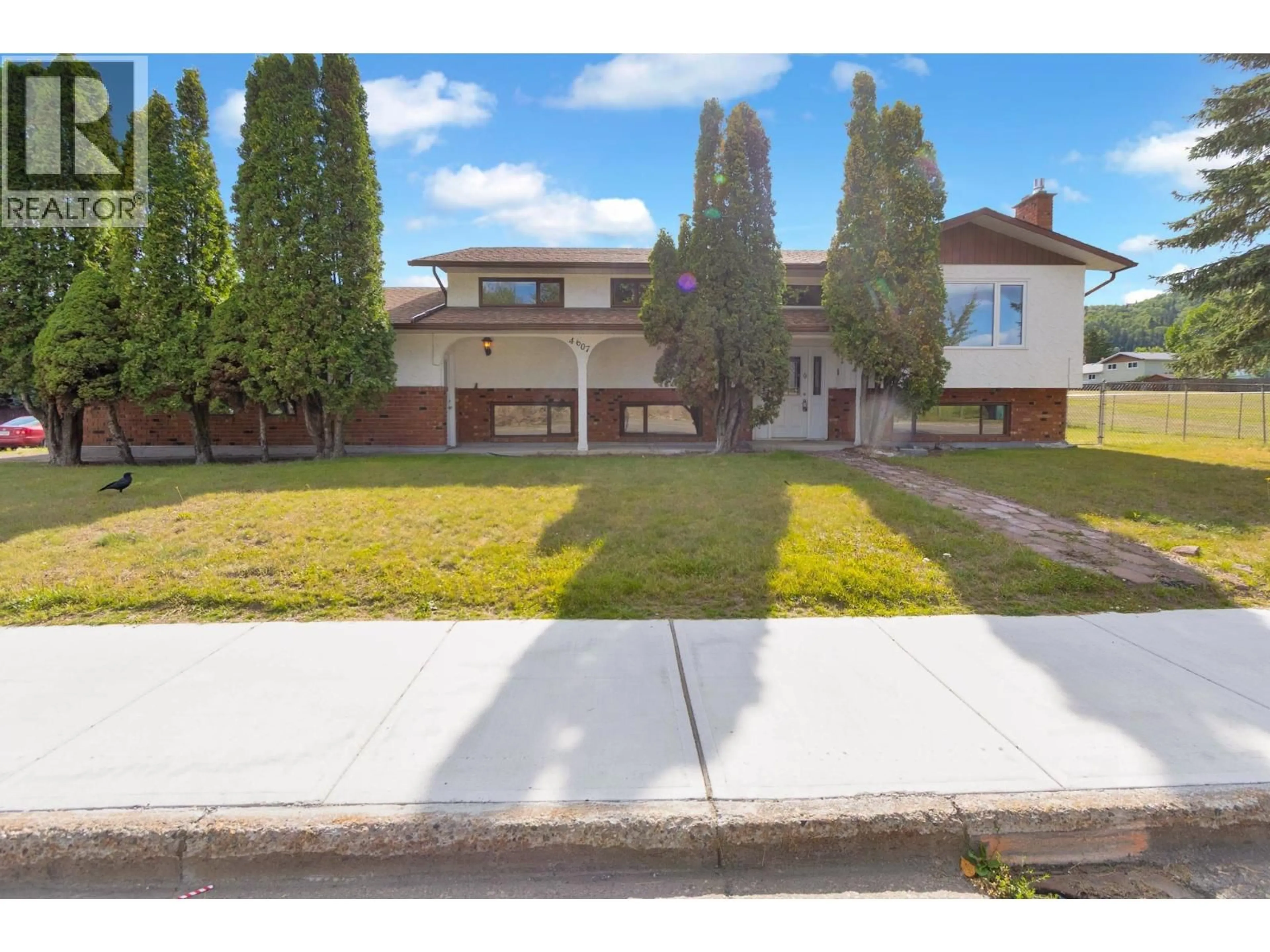 A pic from outside/outdoor area/front of a property/back of a property/a pic from drone, street for 4607 1ST AVENUE, Prince George British Columbia V2M6T9