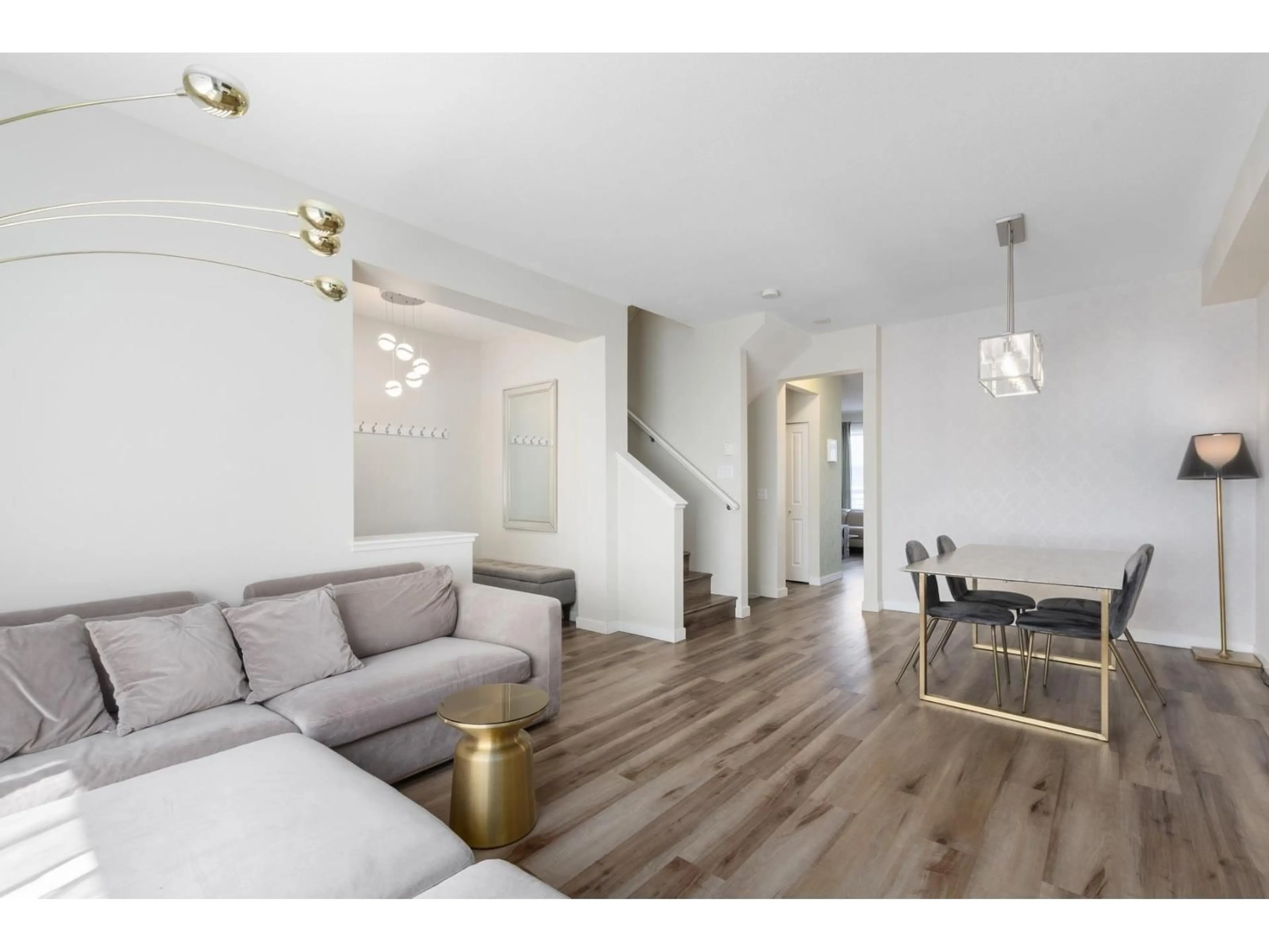 Living room with furniture, wood/laminate floor for 96 - 2738 158, Surrey British Columbia V3Z3K3
