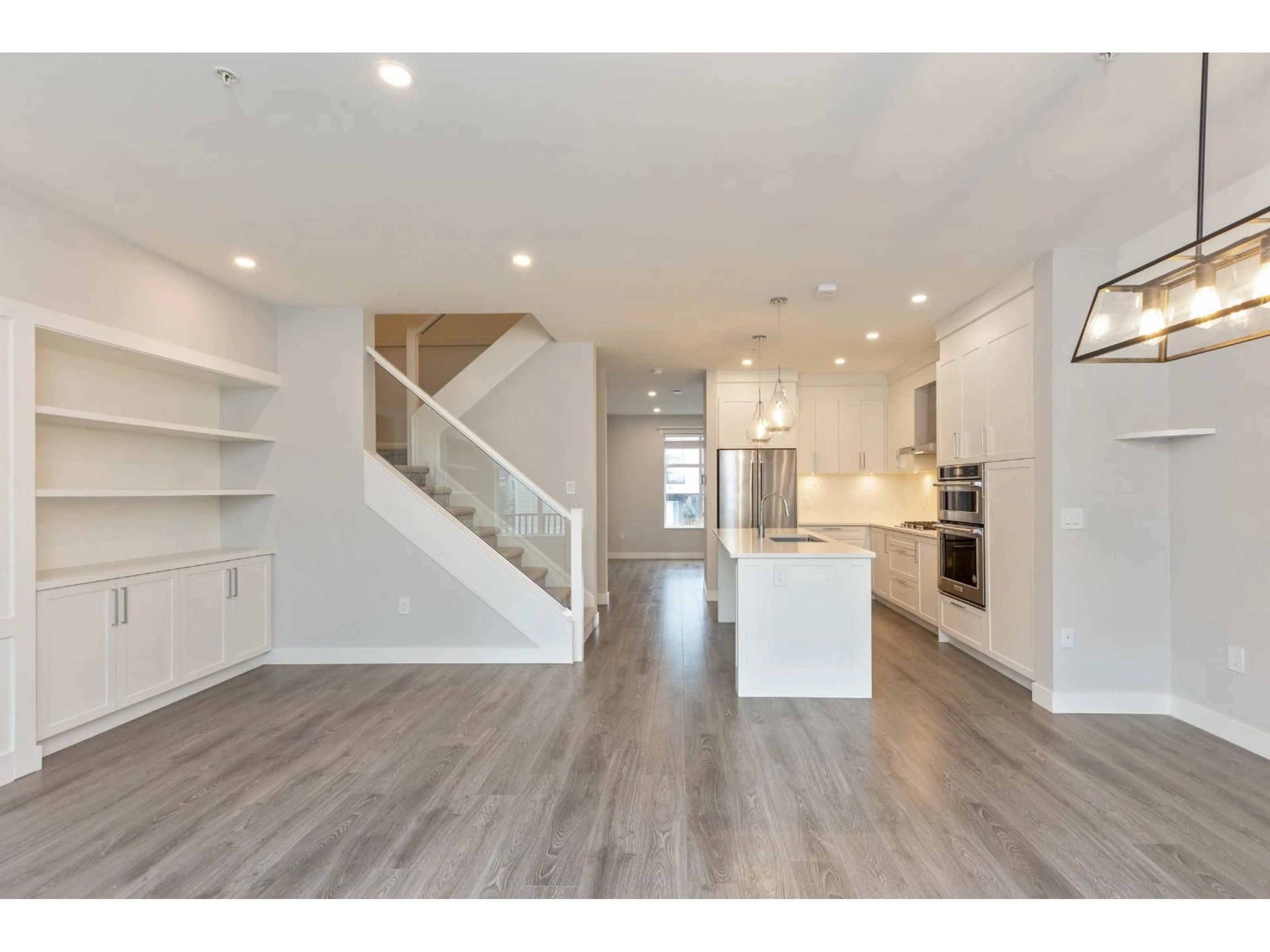 Open concept kitchen, wood/laminate floor for 15 - 20327 72B, Langley British Columbia V2Y4J6